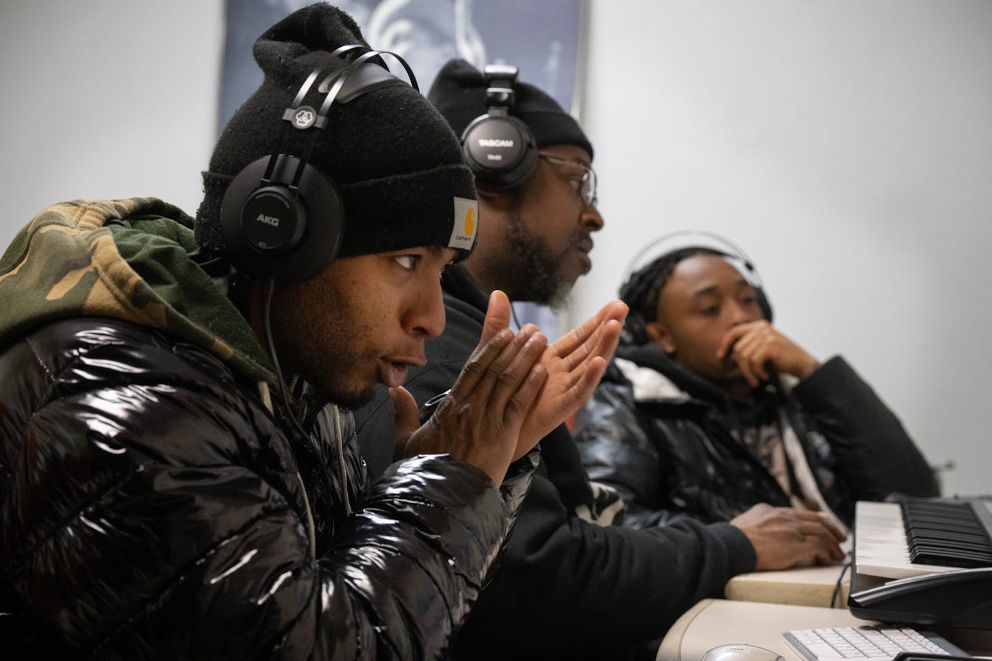 Kevin Washington ,center (a teacher at Walker West Music Academy)  helped music students Wesley Sims left, and Joseph Cole at Walker West Music Academy Thursday January ,18, 2024 in,St. Paul ,Minn. The young men were learning digital music production.]  JERRY HOLT • jerry.holt@startribune.com

Walker West Music Academy is teaming with Ujamaa Place to teach young Black men,  digital music production.