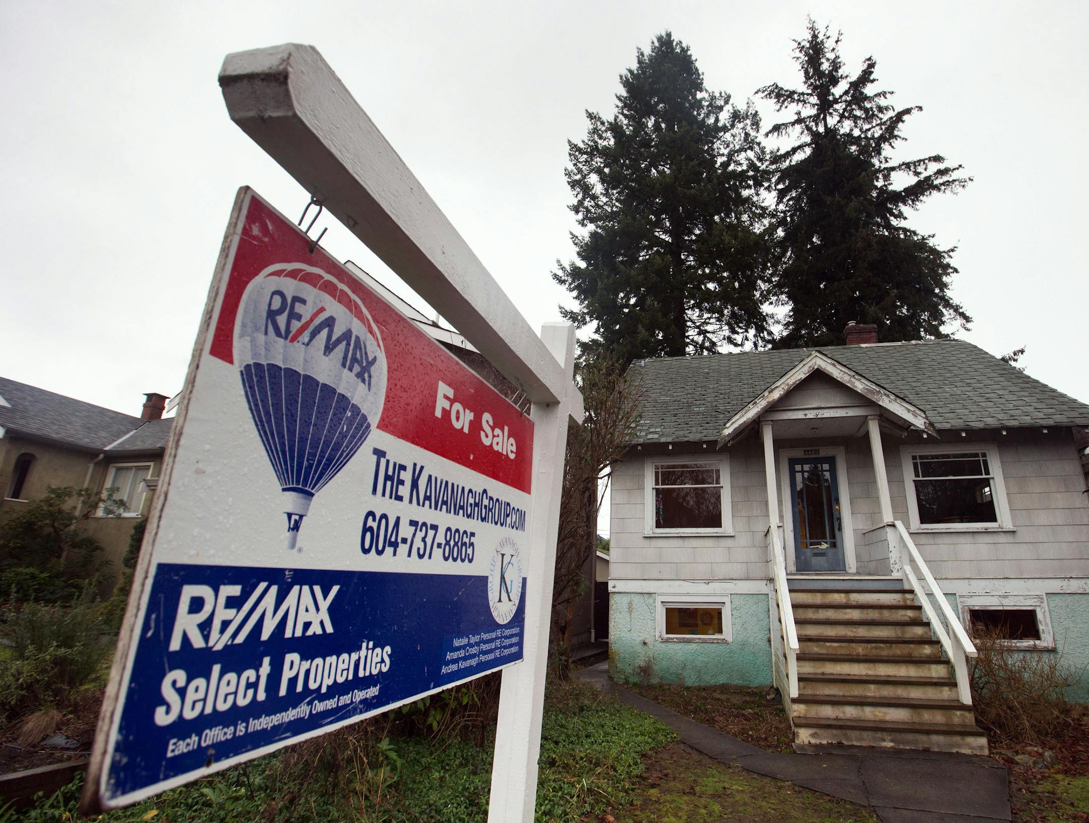 A house built in 1930 that was recently listed for sale for $2.4 million is seen in the Point Grey neighborhood of Vancouver, British Columbia on Friday, Jan. 29, 2016. It's missing a few shingles, the bathroom walls show some rot and it needs a paint job, but the tiny home in a tony Vancouver neighborhood has been listed for nearly $2.4 million and could sell for more. (Darryl Dyck/The Canadian Press via AP) ORG XMIT: VCRD102