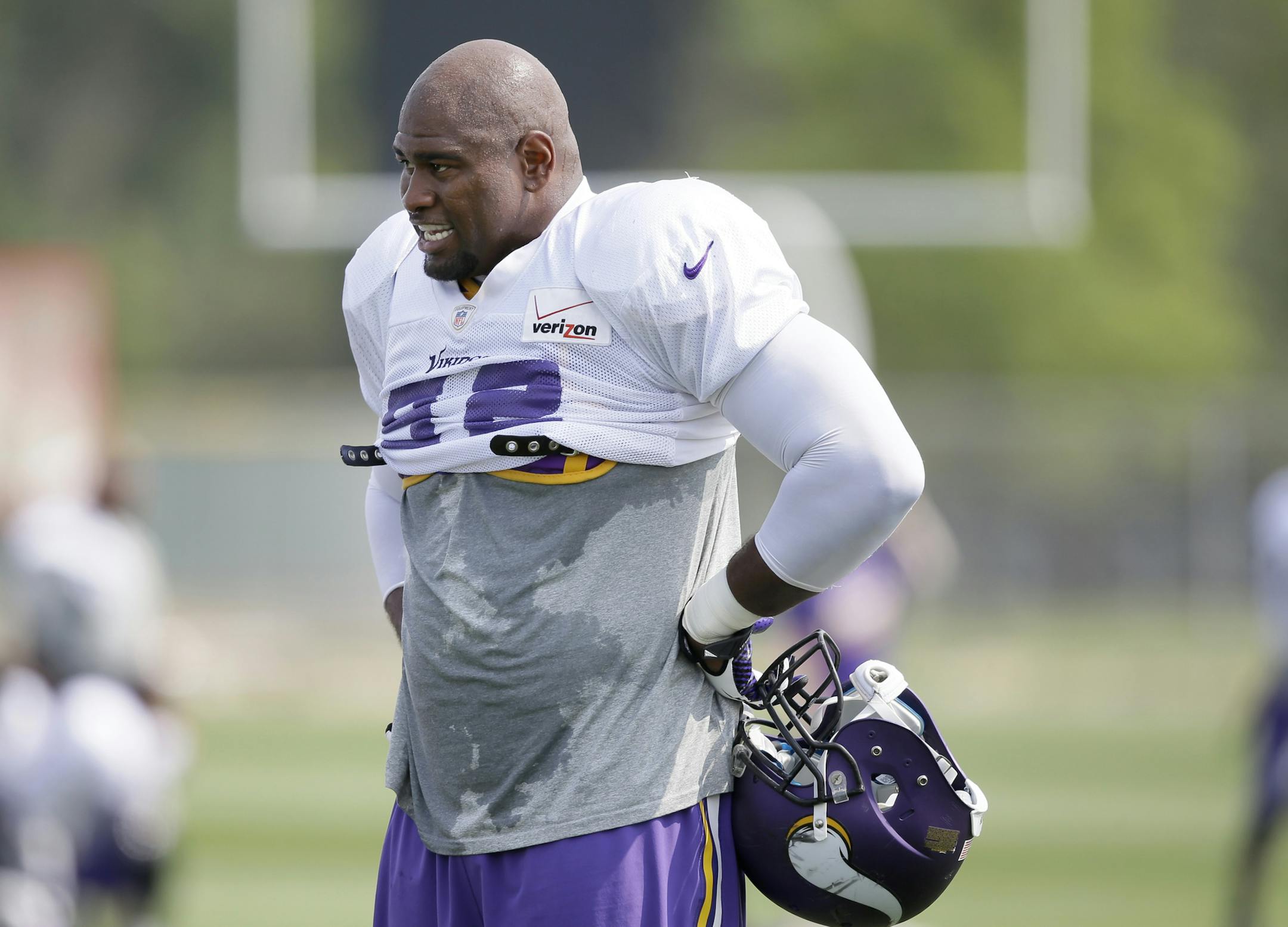 Minnesota Vikings defensive tackle Tom Johnson looks on during an NFL football training camp practice, Friday, Aug. 1, 2014, in Mankato, Minn. (AP Photo/Charlie Neibergall) ORG XMIT: MIN2014082719145161