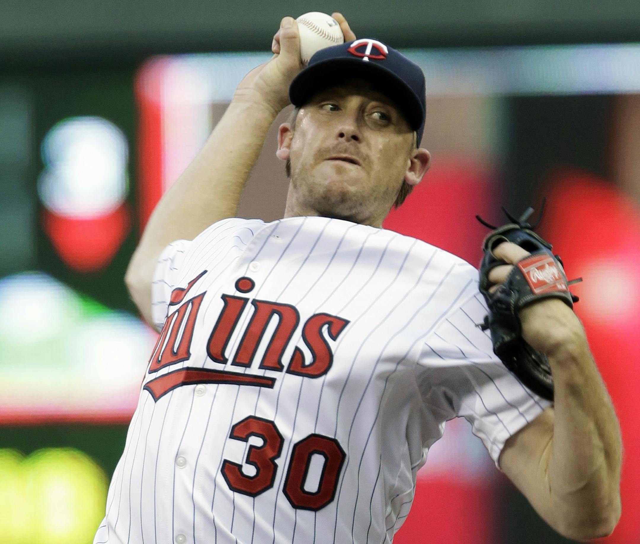 Minnesota Twins pitcher Kevin Correia throws against the Kansas City Royals in the first inning of a baseball game, Tuesday, Aug. 27, 2013 in Minneapolis. (AP Photo/Jim Mone)