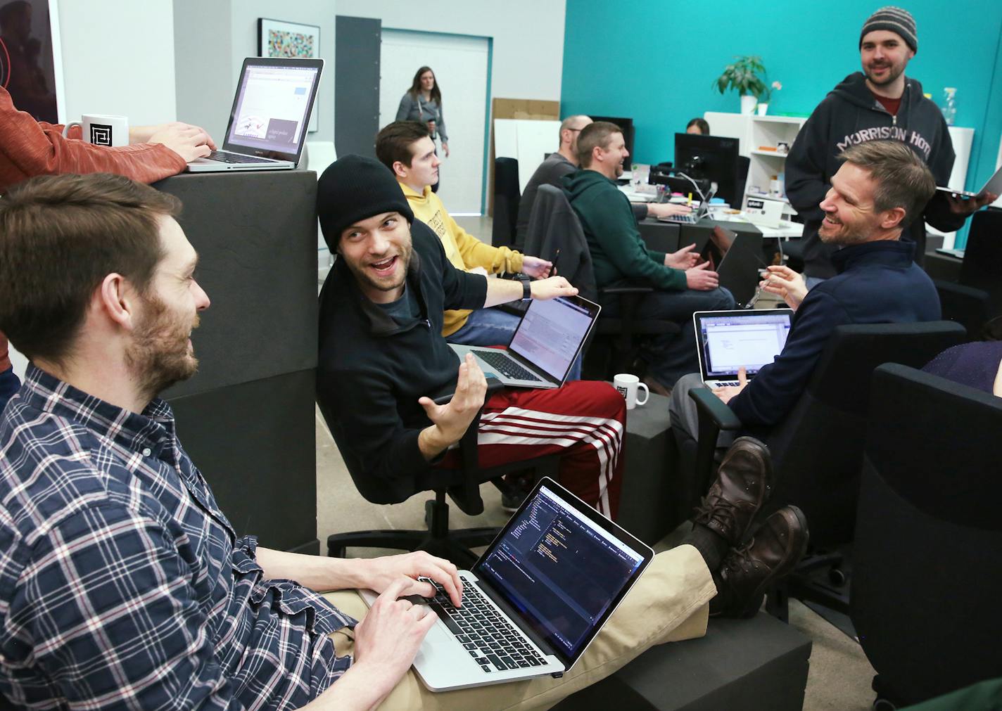 Coding students Nathan Briscoe, left, and Joe Anderson chat before a lecture at Prime Digital Academy in Bloomington on Tuesday, January 12, 2016. ] (Leila Navidi/Star Tribune) leila.navidi@startribune.com BACKGROUND INFORMATION: With the tech sector booming, accelerated learning programs for software developers and IT specialists are popping up around the country, including in the Twin Cities, where three programs train future coders.