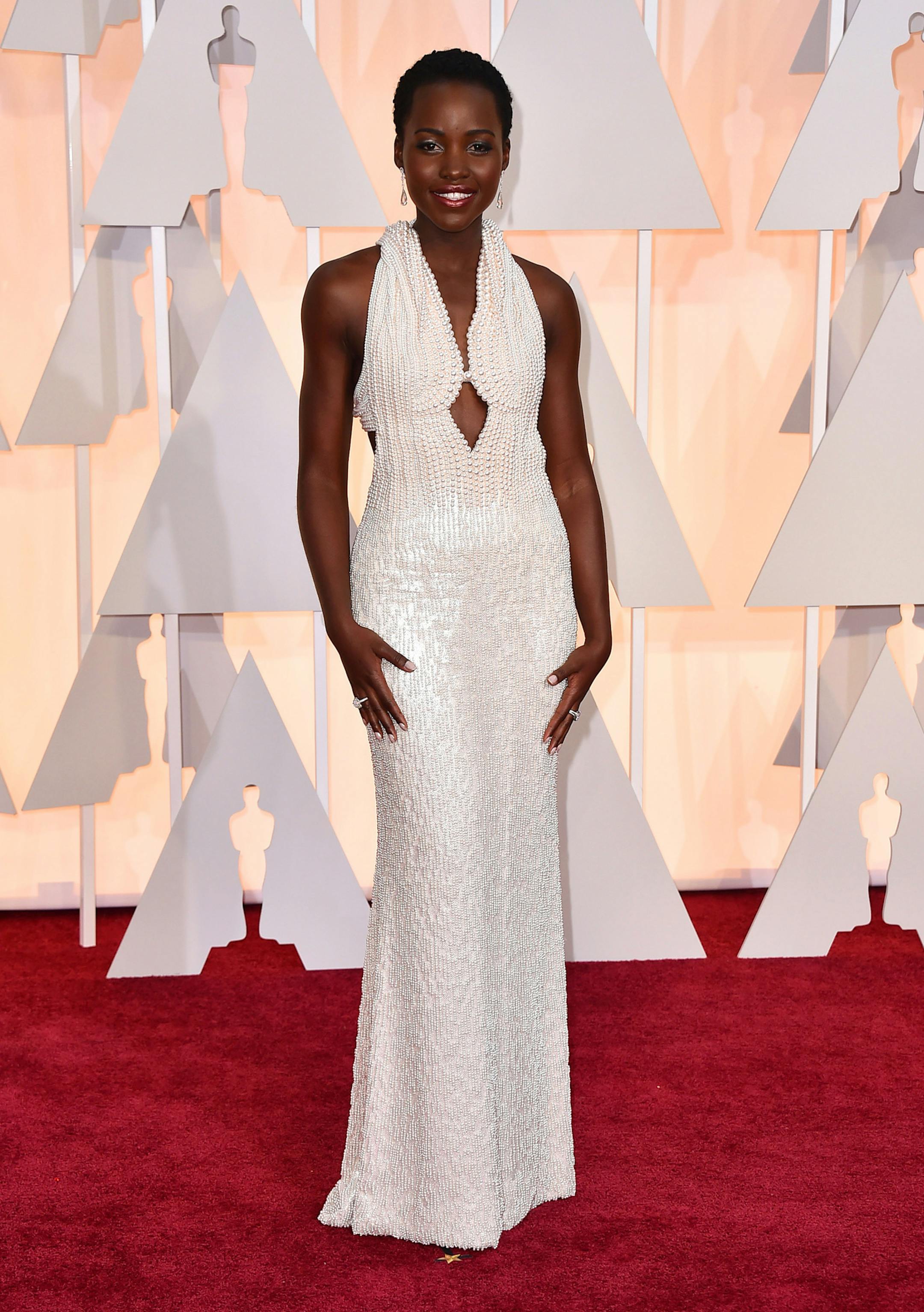 Lupita Nyong'o arrives at the Oscars on Sunday, Feb. 22, 2015, at the Dolby Theatre in Los Angeles. (Photo by Jordan Strauss/Invision/AP)