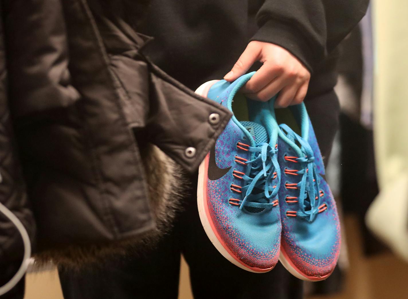 A small boutique store called Saber Nation Station welcomes students at the center of Shakopee's expanded high school, where teens can get personal hygiene items, clothes and other essentials. Here, a student is seen with a new used pair of tennis shoes Tuesday, April 10, 2018, at Shakopee High School in Shakopee, MN.] DAVID JOLES &#xef; david.joles@startribune.com A small boutique now welcomes students at the center of Shakopee's expanded high school, where teens can rummage through racks of cl