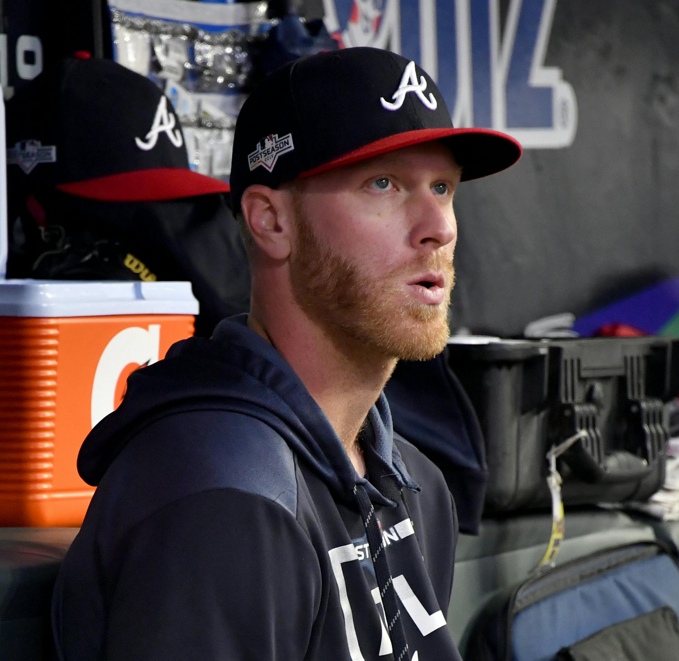 Atlanta Braves starting pitcher Mike Foltynewicz sits in the dugout during the sixth inning of Game 5 of their National League Division Series baseball game against the St. Louis Cardinals, Wednesday, Oct. 9, 2019, in Atlanta. (AP Photo/John Amis)