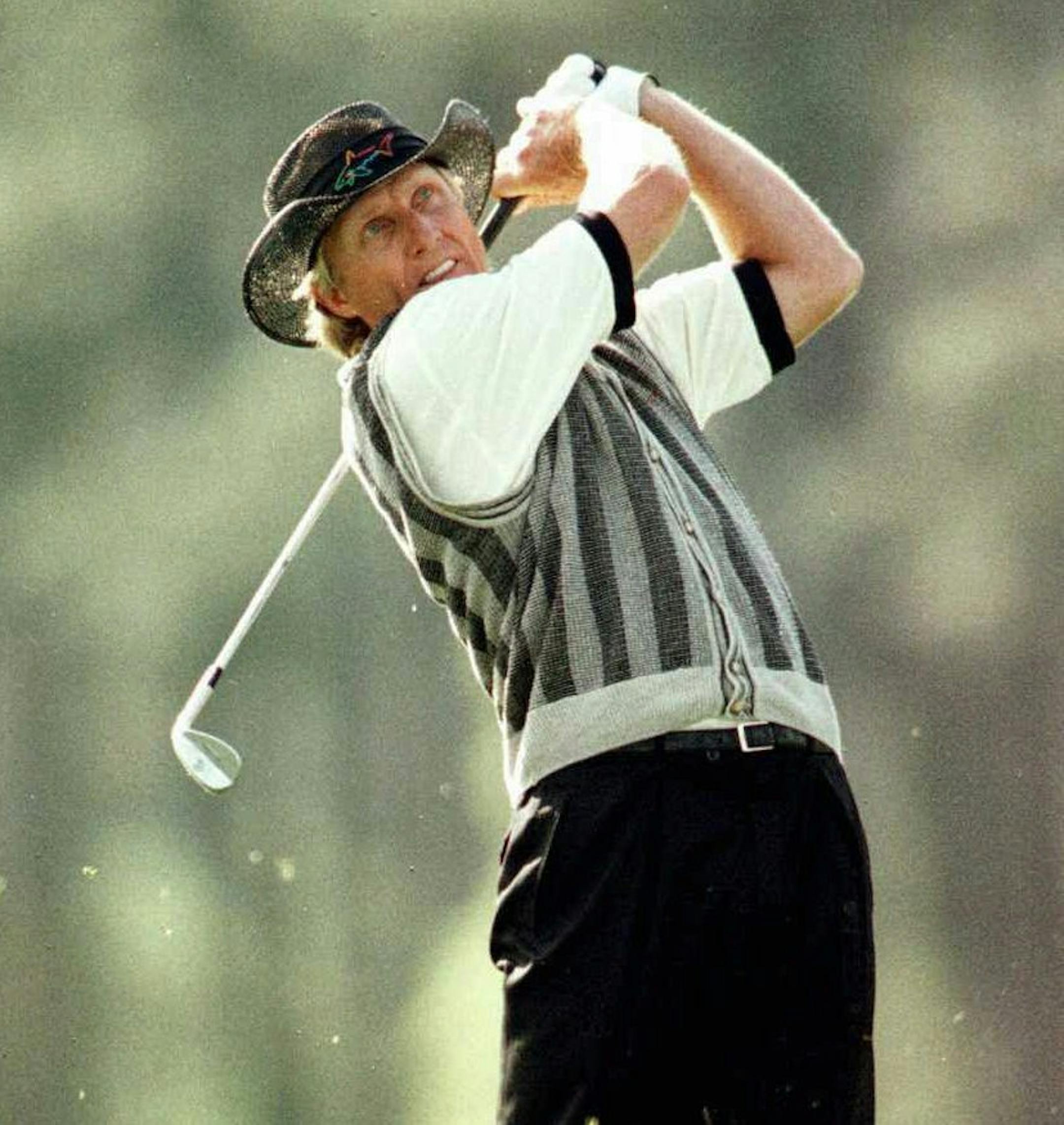 11 Apr 1996: Greg Norman of Australia watches his shot as he equals the coure record of 63 during the first round of the Masters golf tournament at the Augusta National Golf Club in Augusta, Georgia. Mandatory Credit: Stephen Munday/ALLSPORT