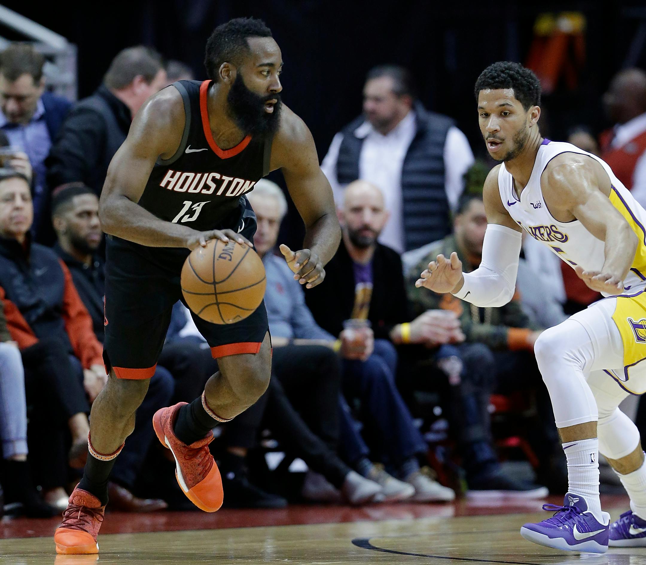 Houston Rockets guard James Harden (13) looks for a way around Los Angeles Lakers guard Josh Hart (5) in the first half of an NBA basketball game Sunday, Dec. 31, 2017, in Houston. (AP Photo/Michael Wyke)