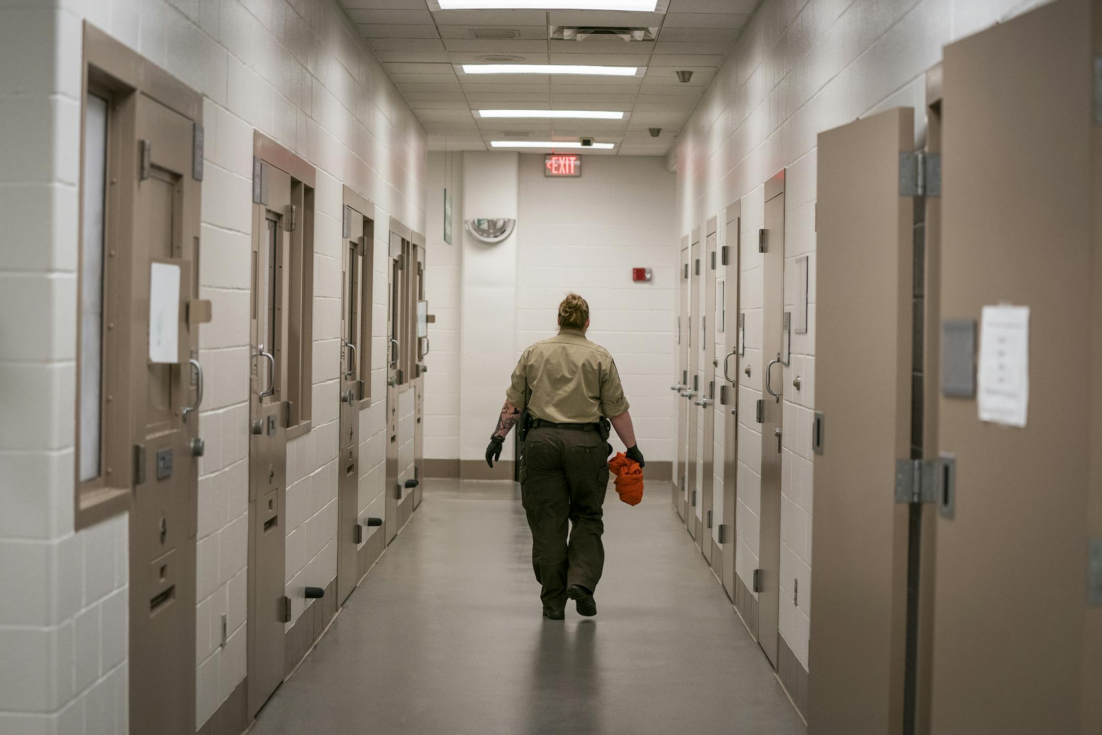 A deputy walks down the hallway of the intake area in the basement of the Hennepin County Jail. ] LEILA NAVIDI &#xa5; leila.navidi@startribune.com BACKGROUND INFORMATION: The Hennepin County Jail in downtown Minneapolis seen on Tuesday, April 23, 2019. The Hennepin County Jail will be participating in the Doors Open Minneapolis event.