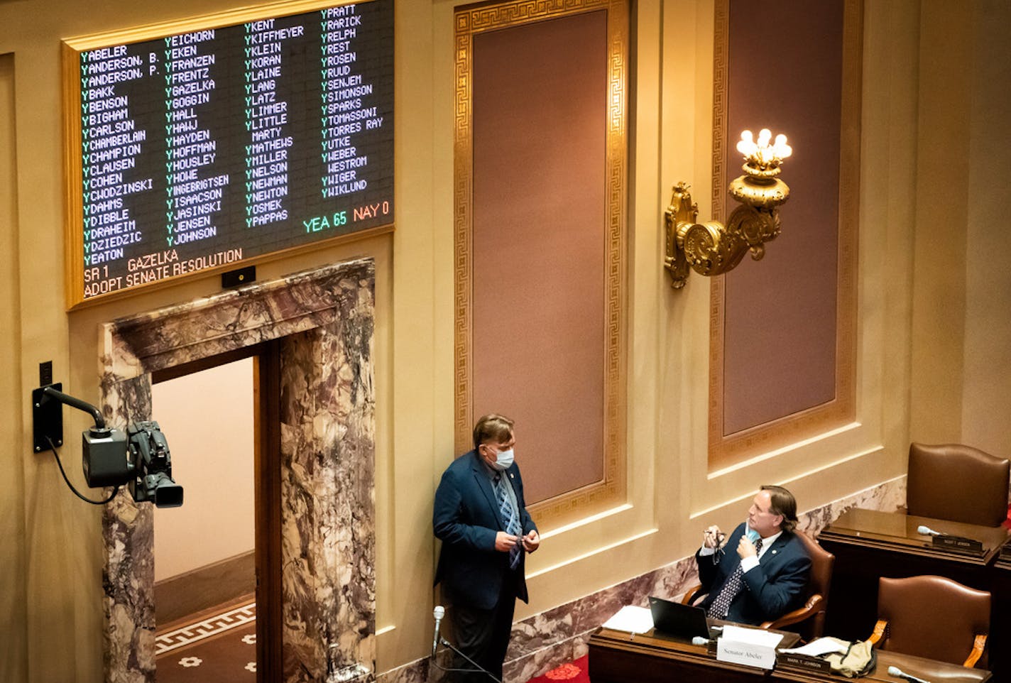 Sen. John Hoffman, DFL-Champlin, and Sen. Jim Abeler, R-Anoka, talked on the Senate floor during the third special session in August.