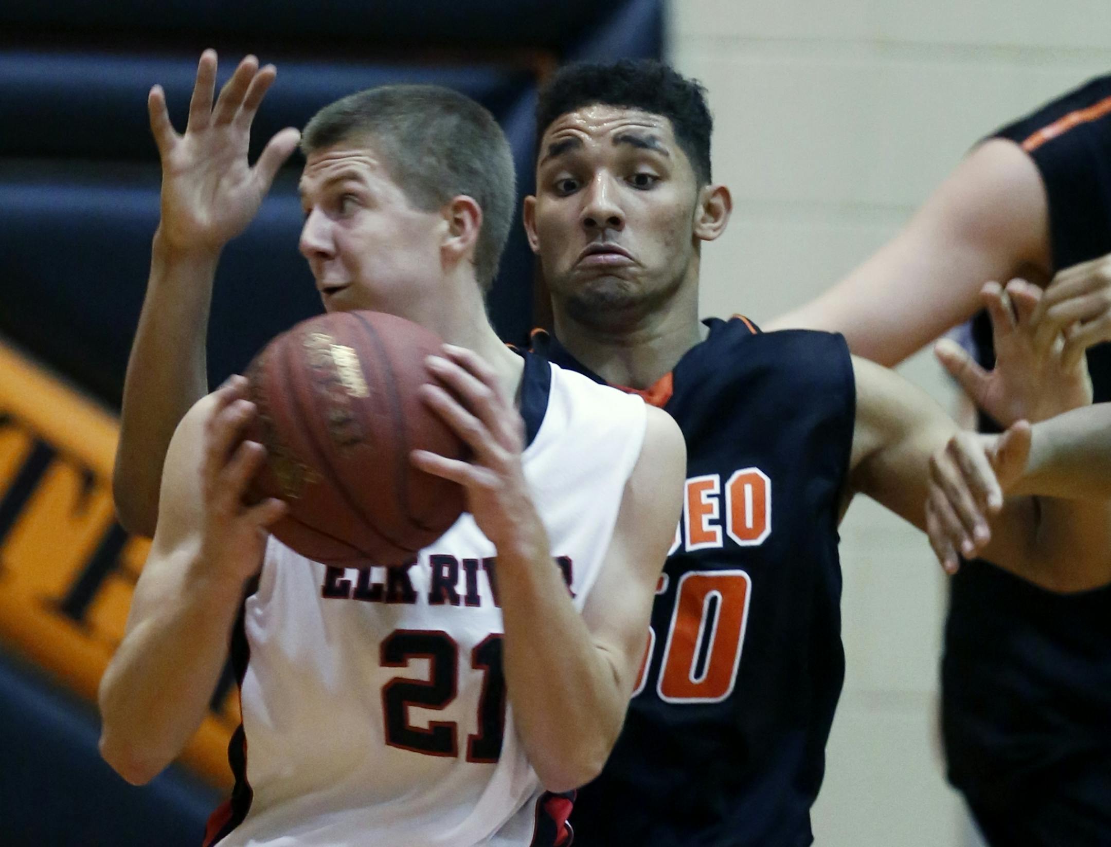 Elk River's Porter Morrell puts the shakes on Osseo's Bridgeport Tusler.