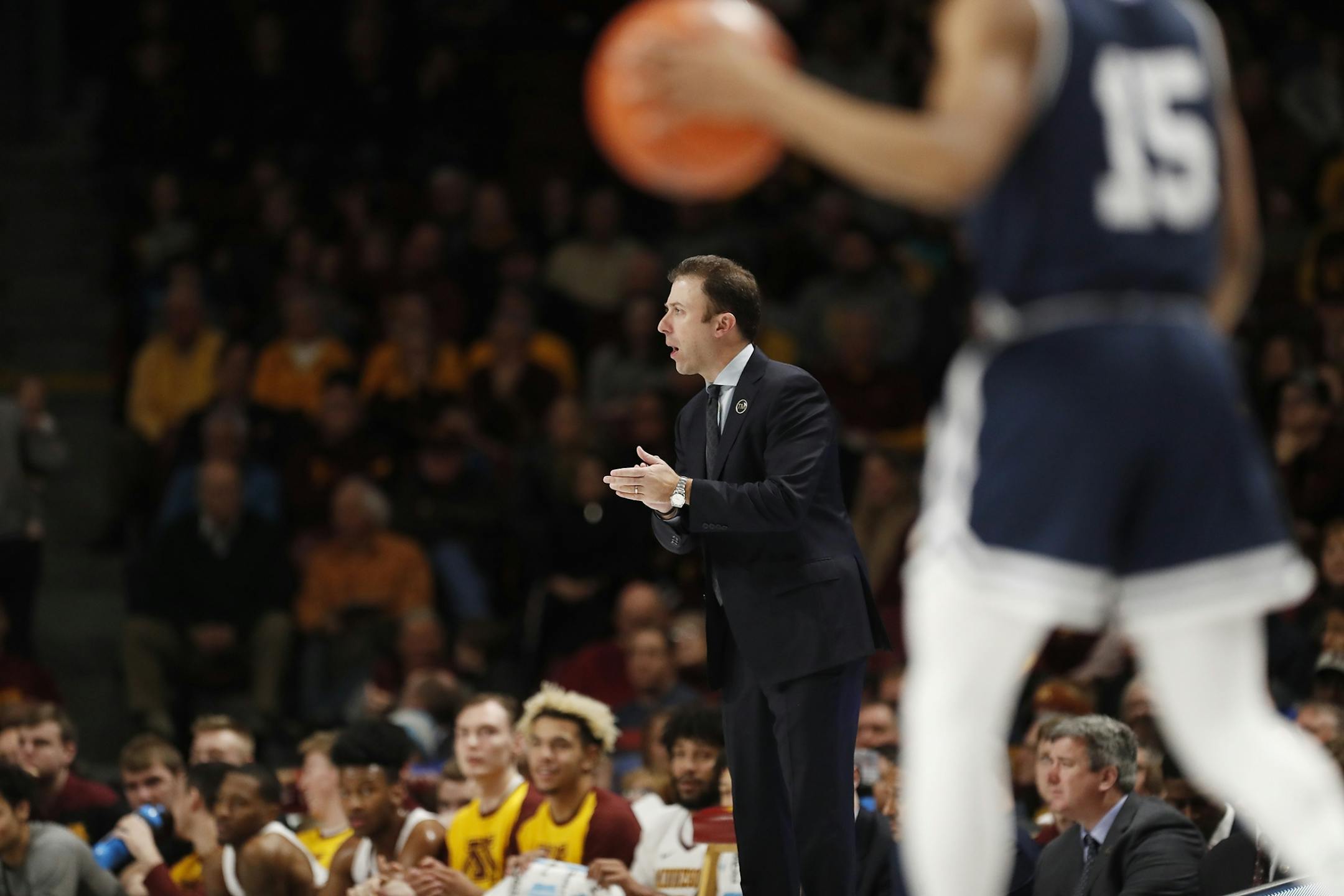 Minnesota head coach Richard Pitino cheers during the first half.