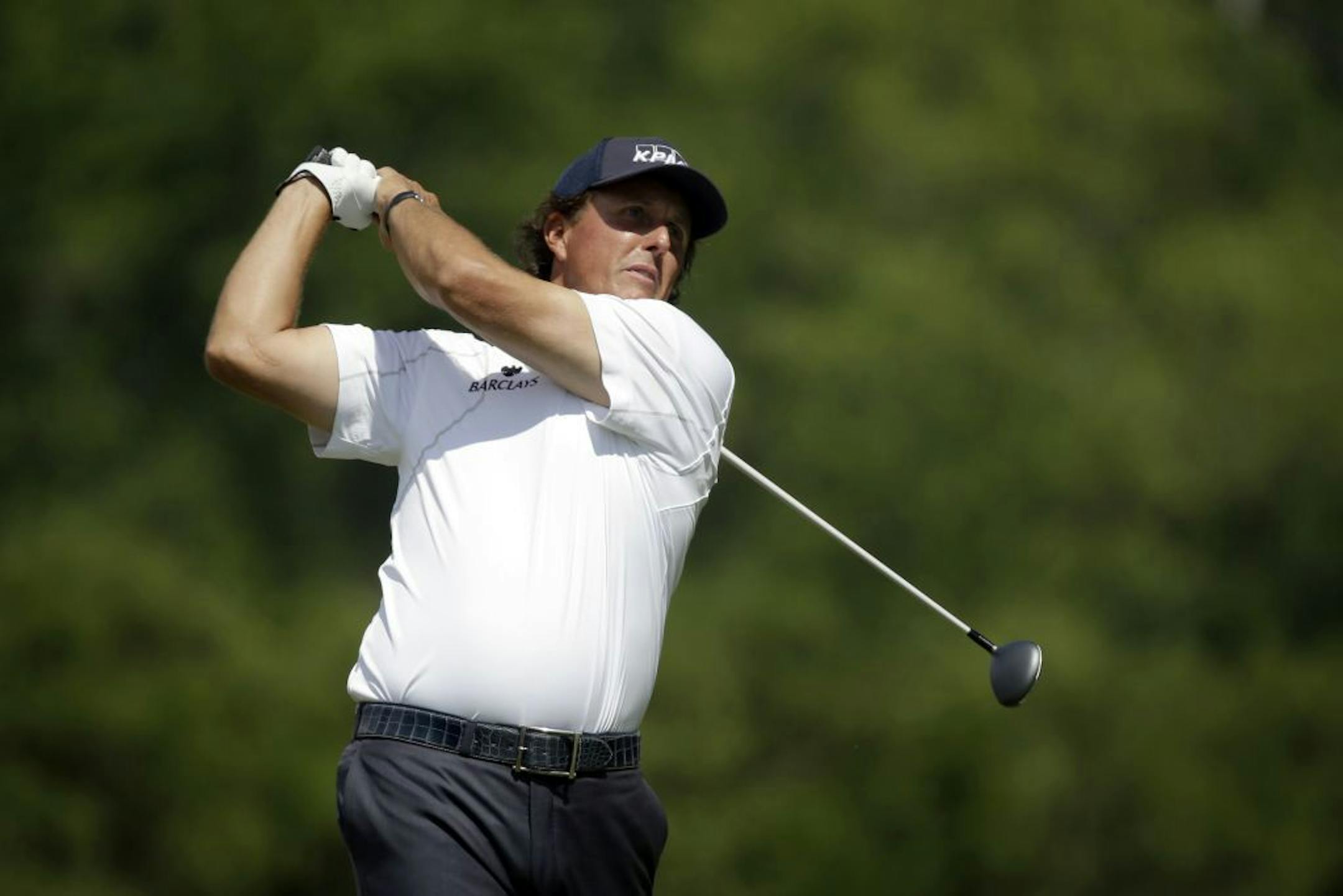 Phil Mickelson tees off on the second hole during the third round of the U.S. Open golf tournament at Merion Golf Club, Saturday, June 15, 2013, in Ardmore, Pa.