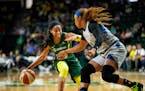 The Lynx's Odyssey Sims defends against Seattle's Jordin Canada during the first quarter