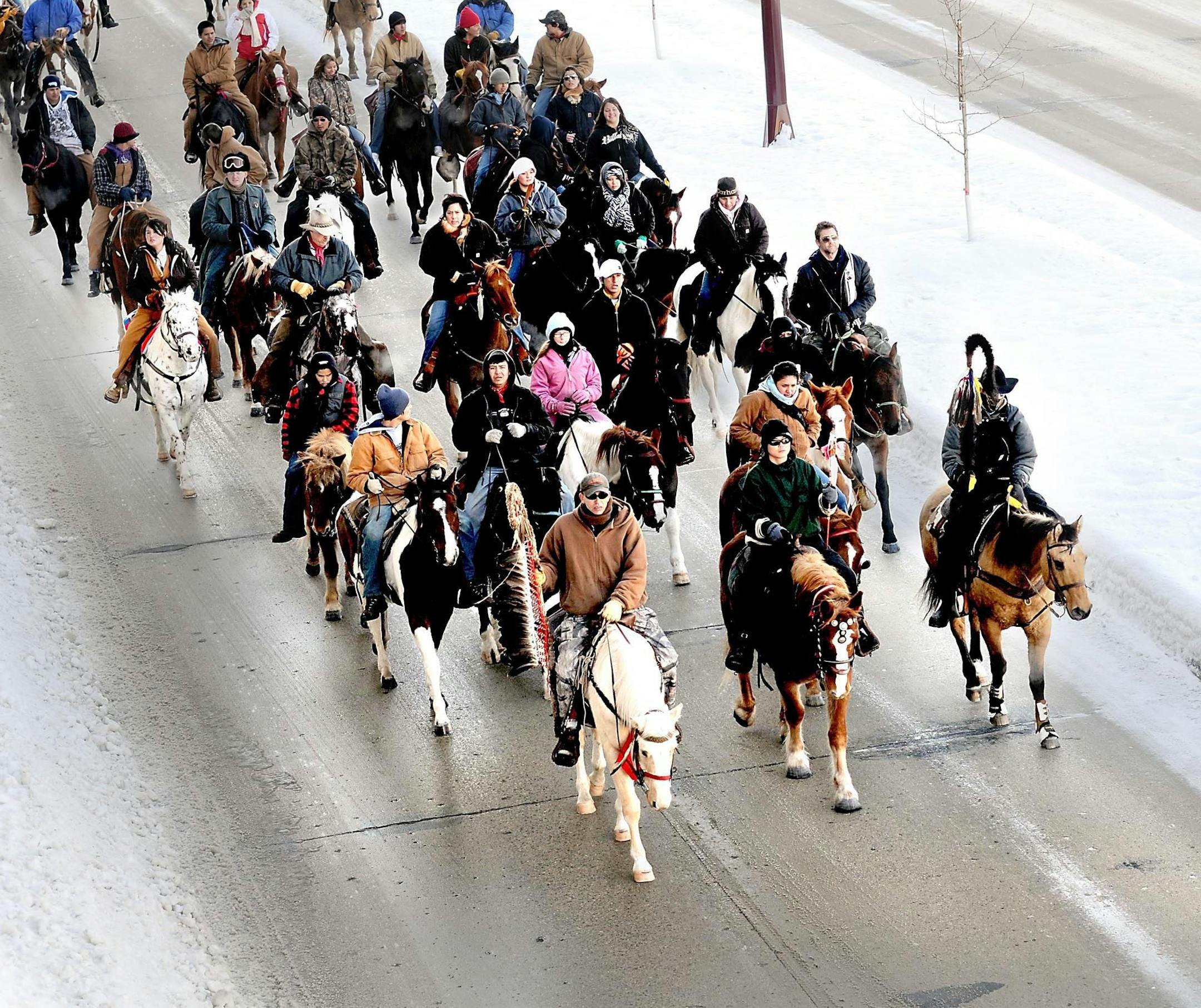 About two dozen horses and riders participating in the fifth annual Dakota 38 Memorial Ride, which began in Brule, S.D., arrived in Mankato on Saturday.