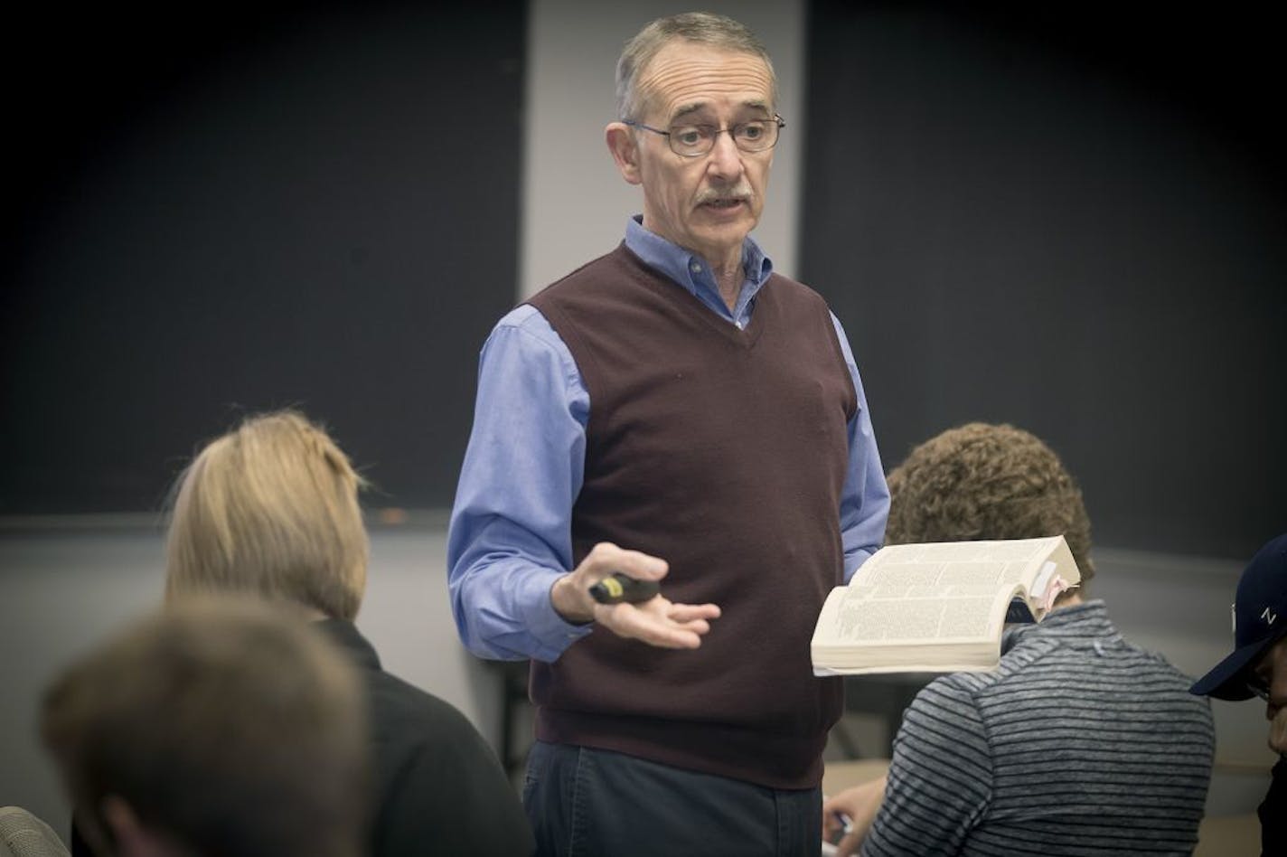 Bethel University students in Prof. Mike Holmes' "Introduction to Bible Studies" class use their cell phone bible apps to follow him while he uses a bible during a class, Wednesday, May 3, 2017 in Arden Hills, MN.