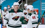 Minnesota Wild left wing Marcus Foligno (17) is congratulated by teammate Jared Spurgeon (46) after scoring a goal against the San Jose Sharks during 