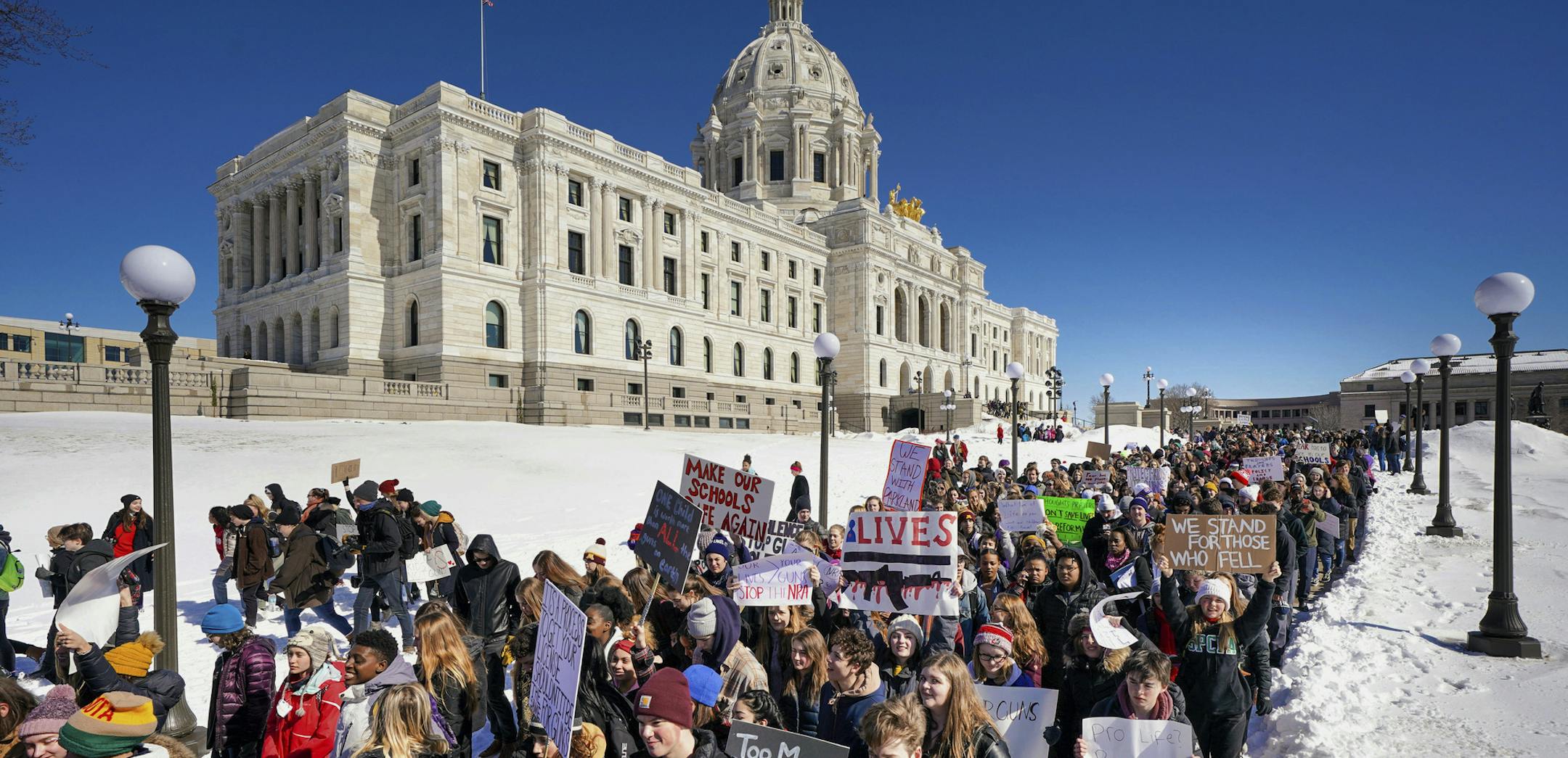 Thousands of high school students march to the state Capitol in Saint Paul, Minn., after they walked out of their schools Wednesday, March 7, 2018, to protest gun violence and pressure lawmakers to enact stricter gun control. (Glen Stubbe/Star Tribune via AP)