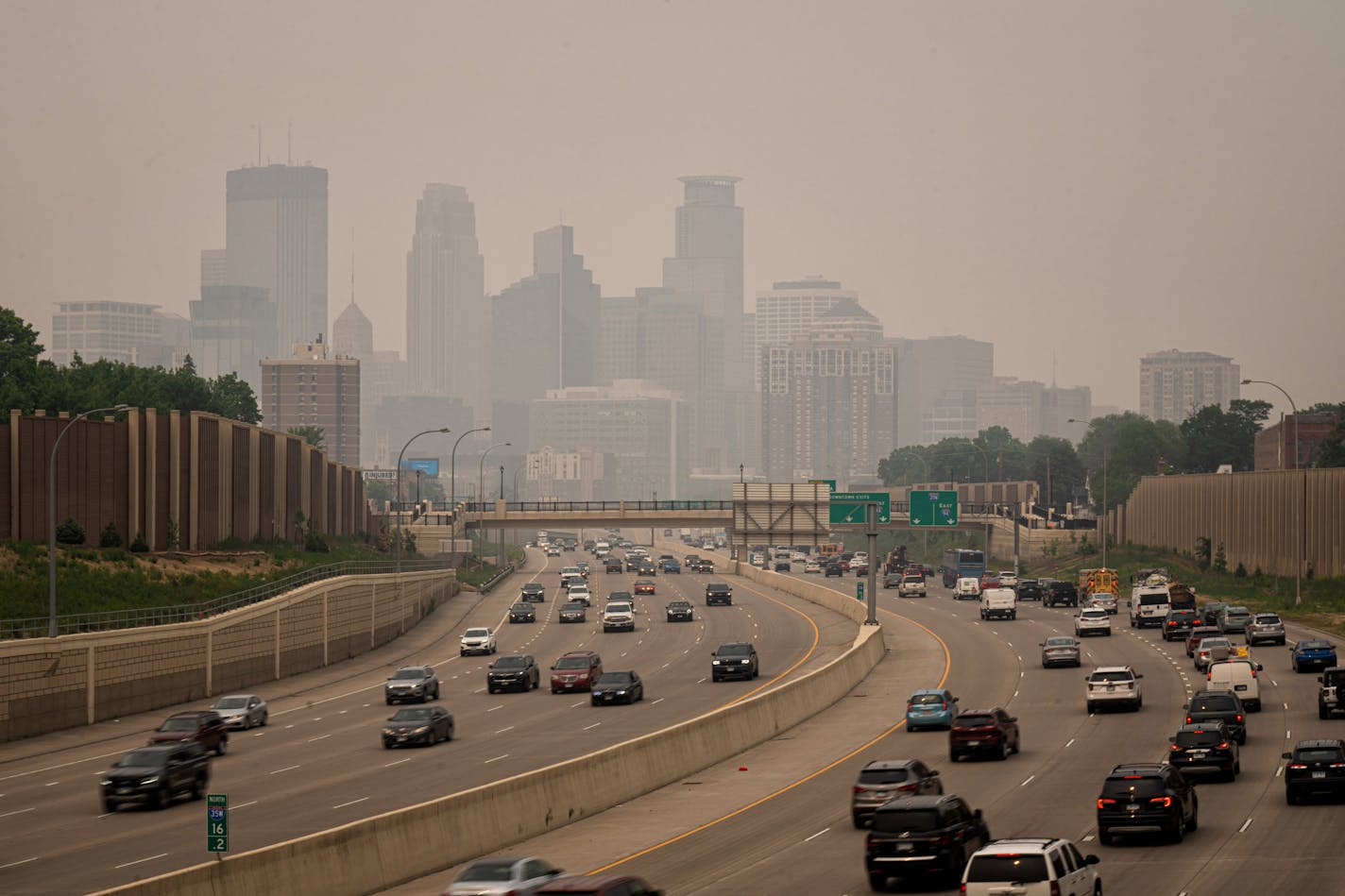 A smoky haze enveloped Minneapolis seen from the south across I-35W Wednesday, June 14, 2023 Minneapolis, Minn. Smoke from Canadian wildfires blowing into Minnesota is making for a bad air day. The MPCA has issued an air quality alert covering the northern half of the state, the metro area and a portion of southern Minnesota. ] GLEN STUBBE • glen.stubbe@startribune.com