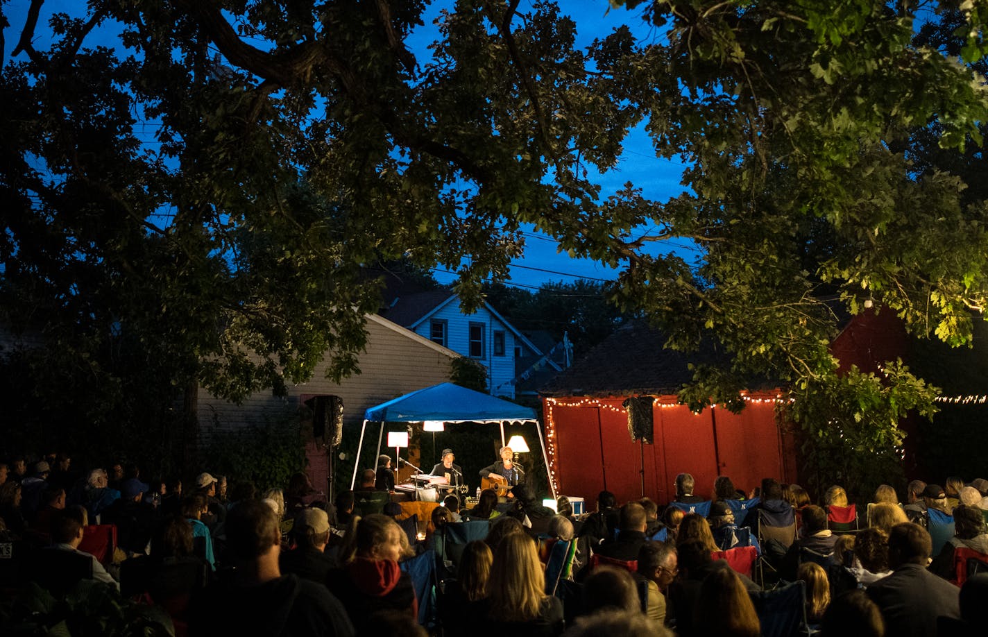 The Pines performed before an overflow crowd of 325 people Saturday night under the branches of a 200-year-old oak tree in the backyard of Sean Kershaw and Tim Hawkins. The Grand Oak Opry concert series brings together residents of St. Paul's West Seventh neighborhood.