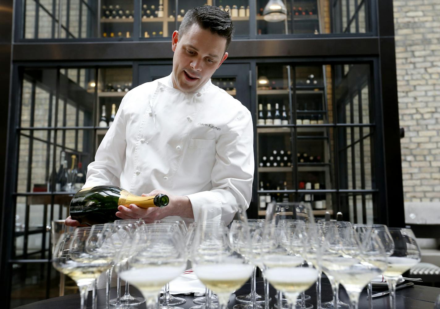 Chef and owner of Spoon and Stable Gavin Kaysen poured champagne for the staff on the day the restaurant was nominated for Best New Restaurant by The James Beard Foundation. It's the first time a Minnesota restaurant has been nominated in the national category. ] CARLOS GONZALEZ cgonzalez@startribune.com, March 24, 2015, Minneapolis, Minn., Restaurant review: Spoon and Stable, chef/owner Gavin Kaysen