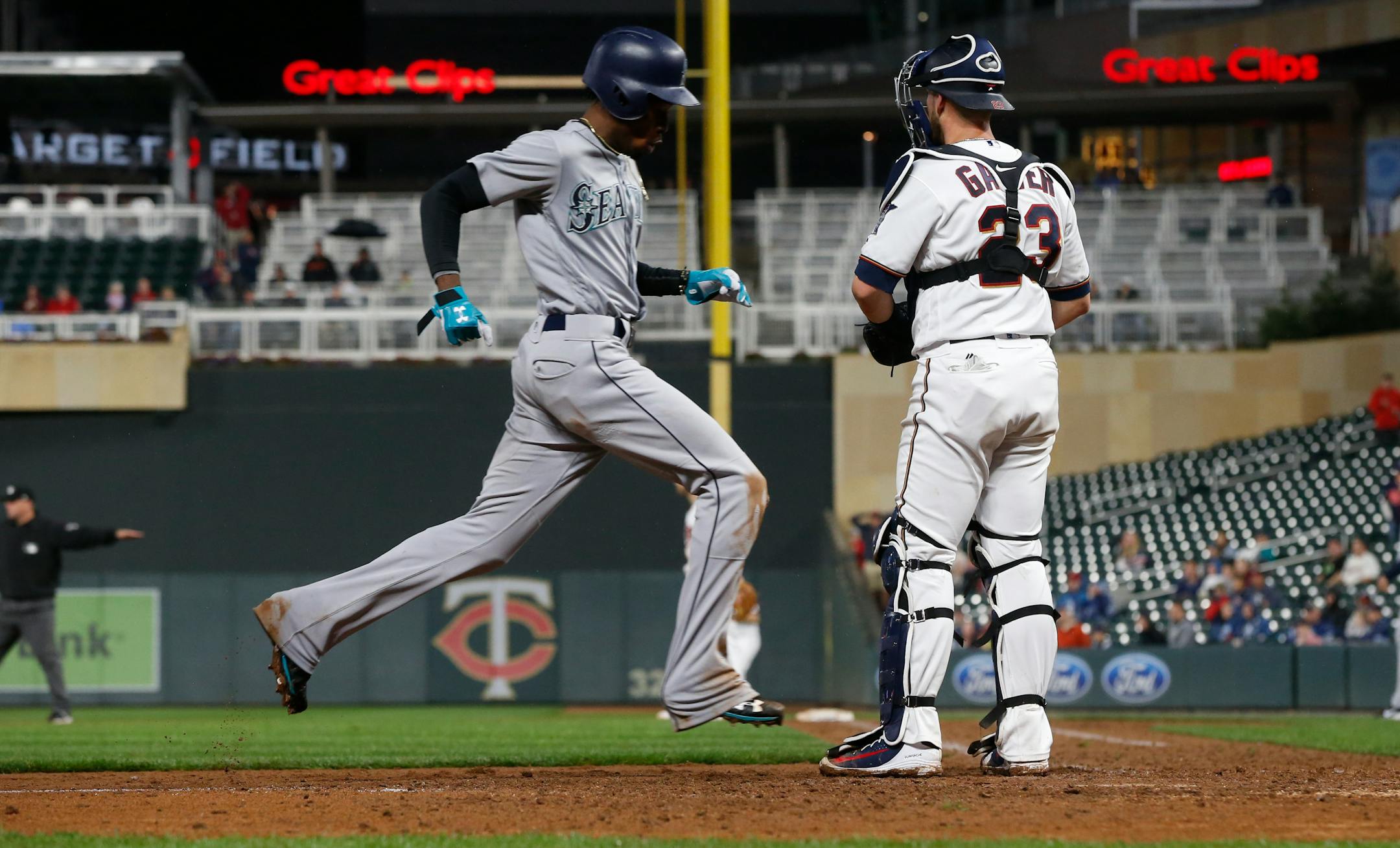 Seattle's Dee Gordon eased his way past Twins catcher Mitch Garver after first baseman Logan Morrison threw a bunt attempt into right field Monday night.