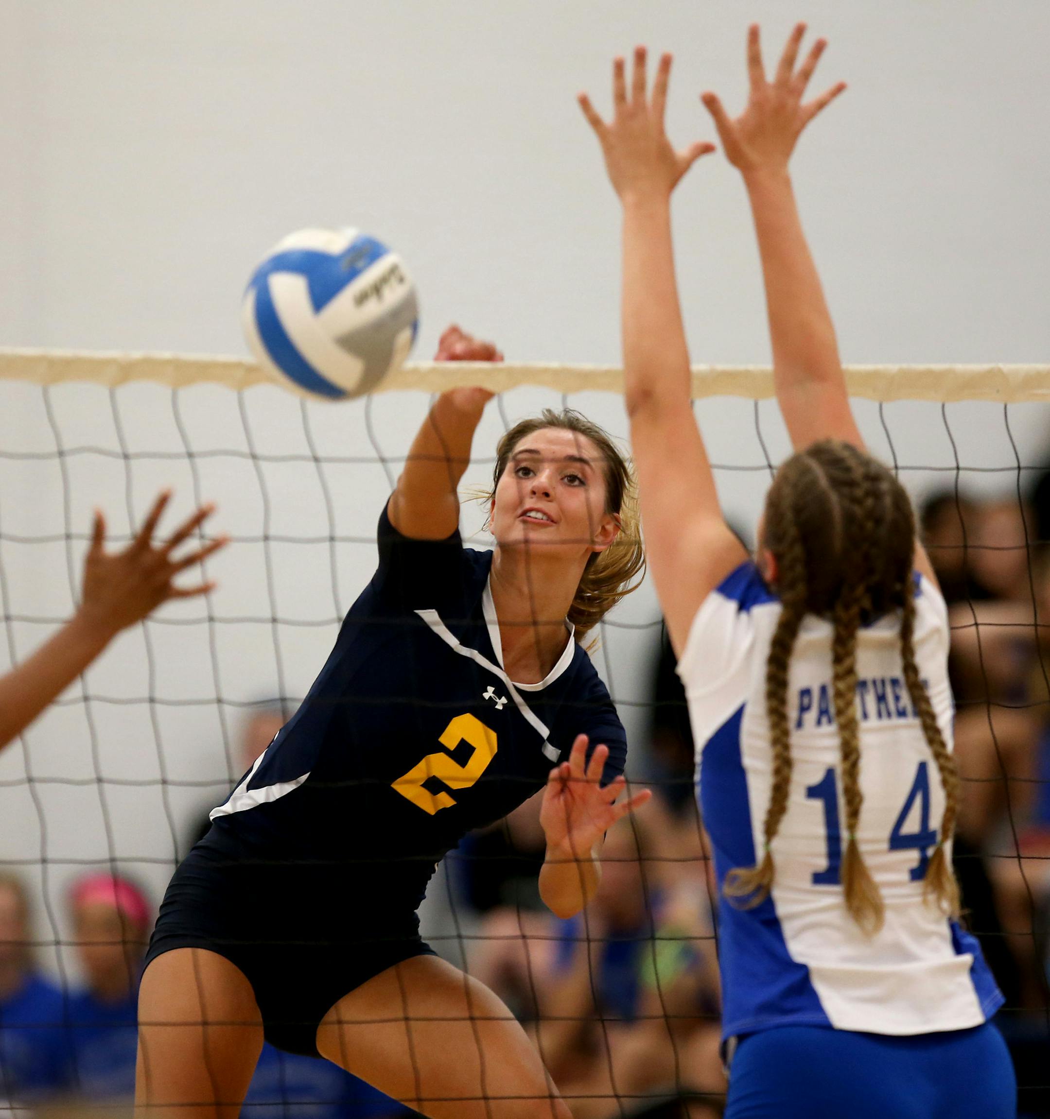 Totino-Grace's Hope Schiller spiked the ball around Spring Lake Park defense. ] (KYNDELL HARKNESS/STAR TRIBUNE) kyndell.harkness@startribune.com Volleyball Totino-Grace vs Spring Lake Park in Fridley Min., Thursday, August, 4, 2014.
