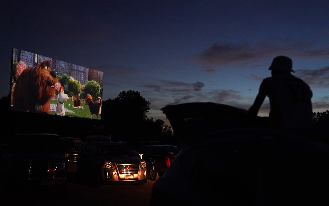 Bryant Howard, 18, watched from the roof of his car during the start of a Friday night show at the Vali-Hi Drive-In in Lake Elmo.