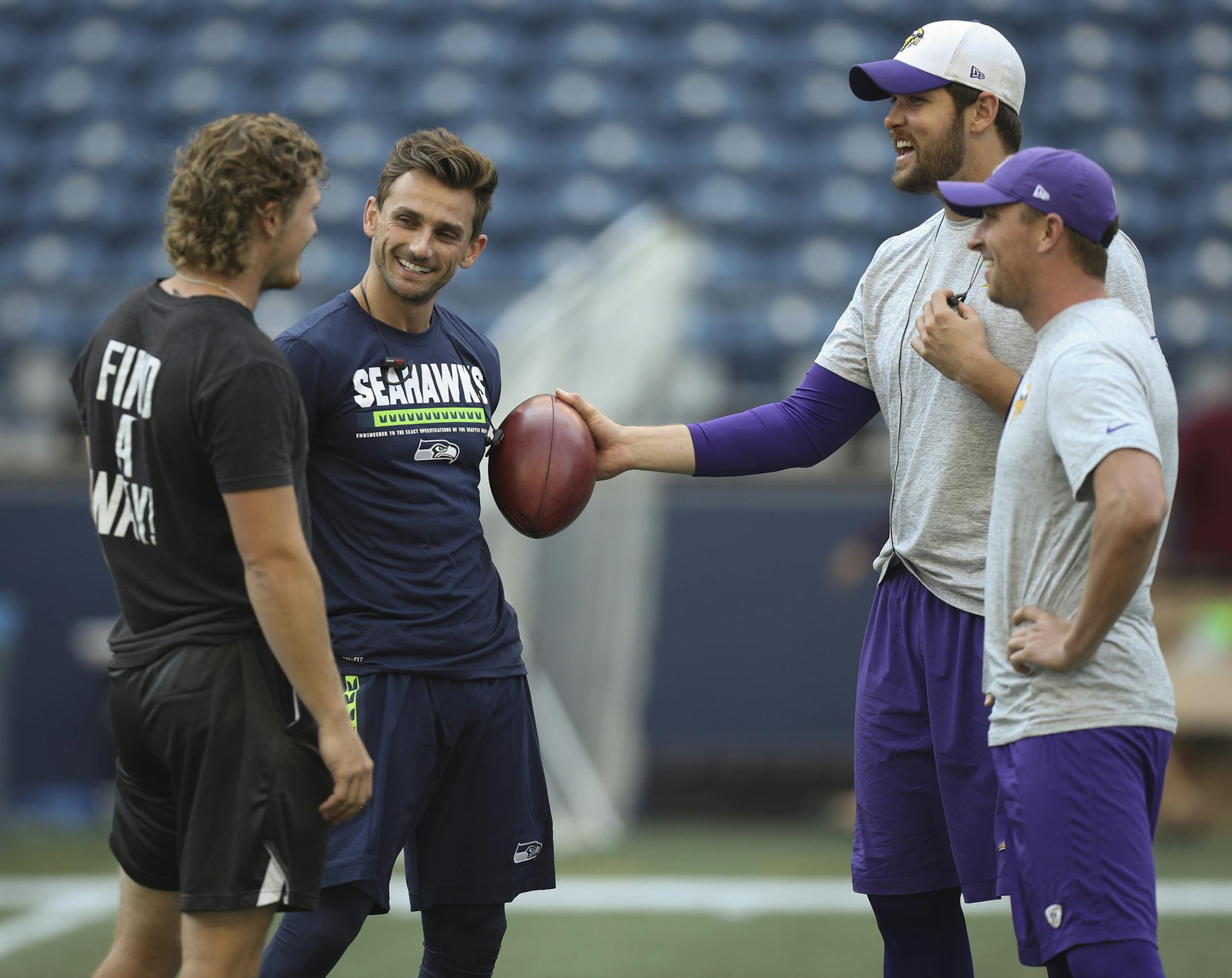 Former Vikings kicker Blair Walsh, now with the Seahawks, said hello to his former teammates, including Vikings long snapper Kevin McDermott, with the ball and his replacement, current Vikings kicker Kai Forbath, right. ] JEFF WHEELER ï jeff.wheeler@startribune.com The Minnesota Vikings faced the Seattle Seahawks in a preseason NFL game Friday night, August 18, 2017 at CenturyLinik Field in Seattle.