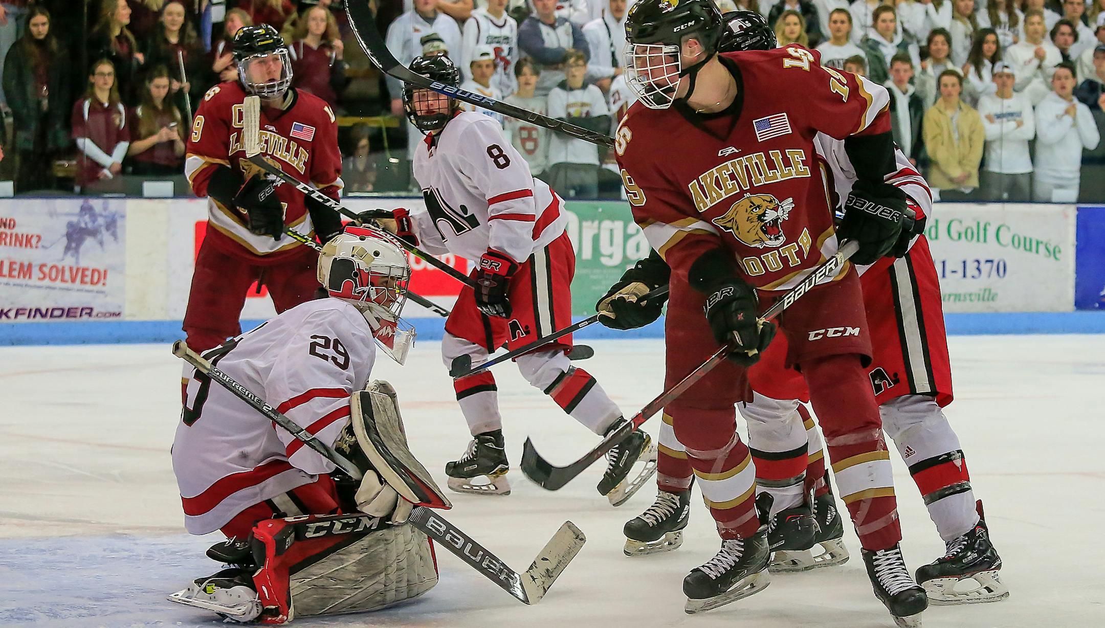 Lakeville South's Cade Ahrenholz (19) put pressure on the North goaltender Caleb Meyer (29) in the second period. Ahrenholz scored the second of South's two first-period goals.
Lakeville North vs. Lakeville South, Section 1AA final, 2-28-19. Photo by Mark Hvidsten, SportsEngine