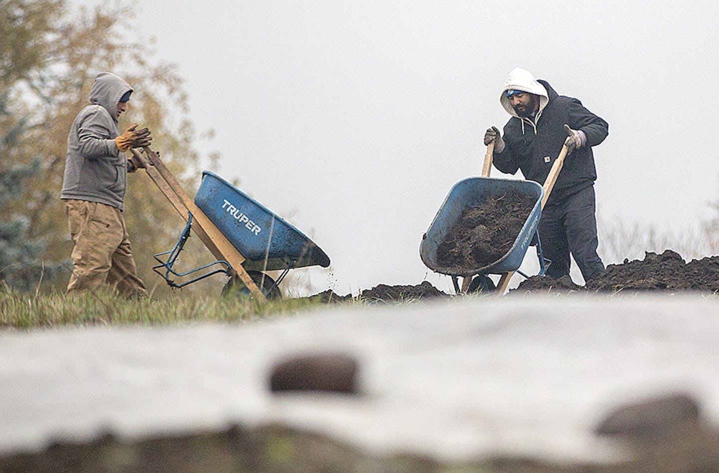 Workers moved soil and were finishing construction of one burial mound near the Southeast corner of McKenzie Point Road and Hwy. 101 and Grays Bay Blvd., Thursday, November 2, 2017 in Wayzata, MN. More than two years ago, a state highway project near Lake Minnetonka dug up burial mounds of the Dakota tribe, something that should've been avoided by surveys of the area. Now, the state and Gov. Mark Dayton have met with elders to discuss how the restoration of those mounds is going and how this can