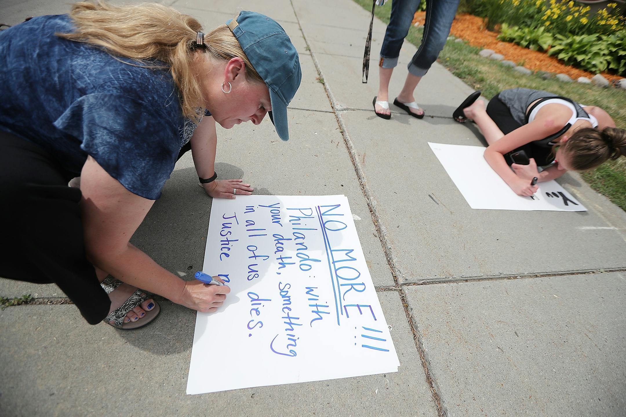Kathryn Sharpe, cq, of Minneapolis created signs to place near the scene where Philando Castile was shot by a police officer, Thursday, July 7, 2016 in Falcon Heights, MN. Toso lives a less than a block away.
