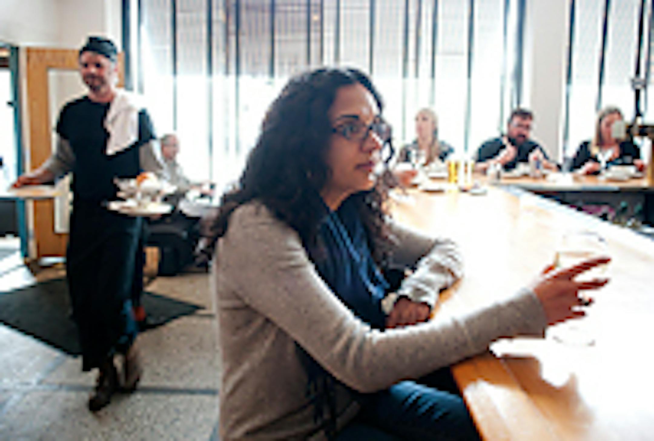 First Avenue booking agent Sonia Grover has a glass of wine at Nick and Eddie