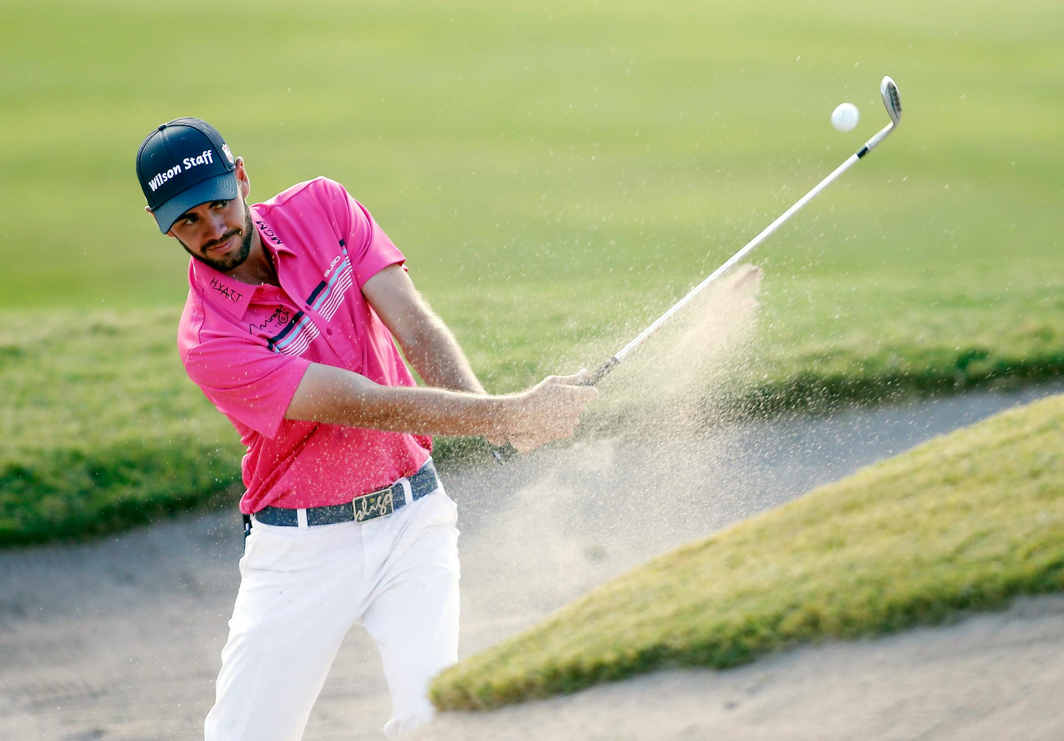 Troy Merritt hits from the bunker on the tenth hole during the first round of the Shriners Hospitals for Children Open golf tournament Thursday, Oct. 22, 2015, in Las Vegas. (AP Photo/Isaac Brekken)