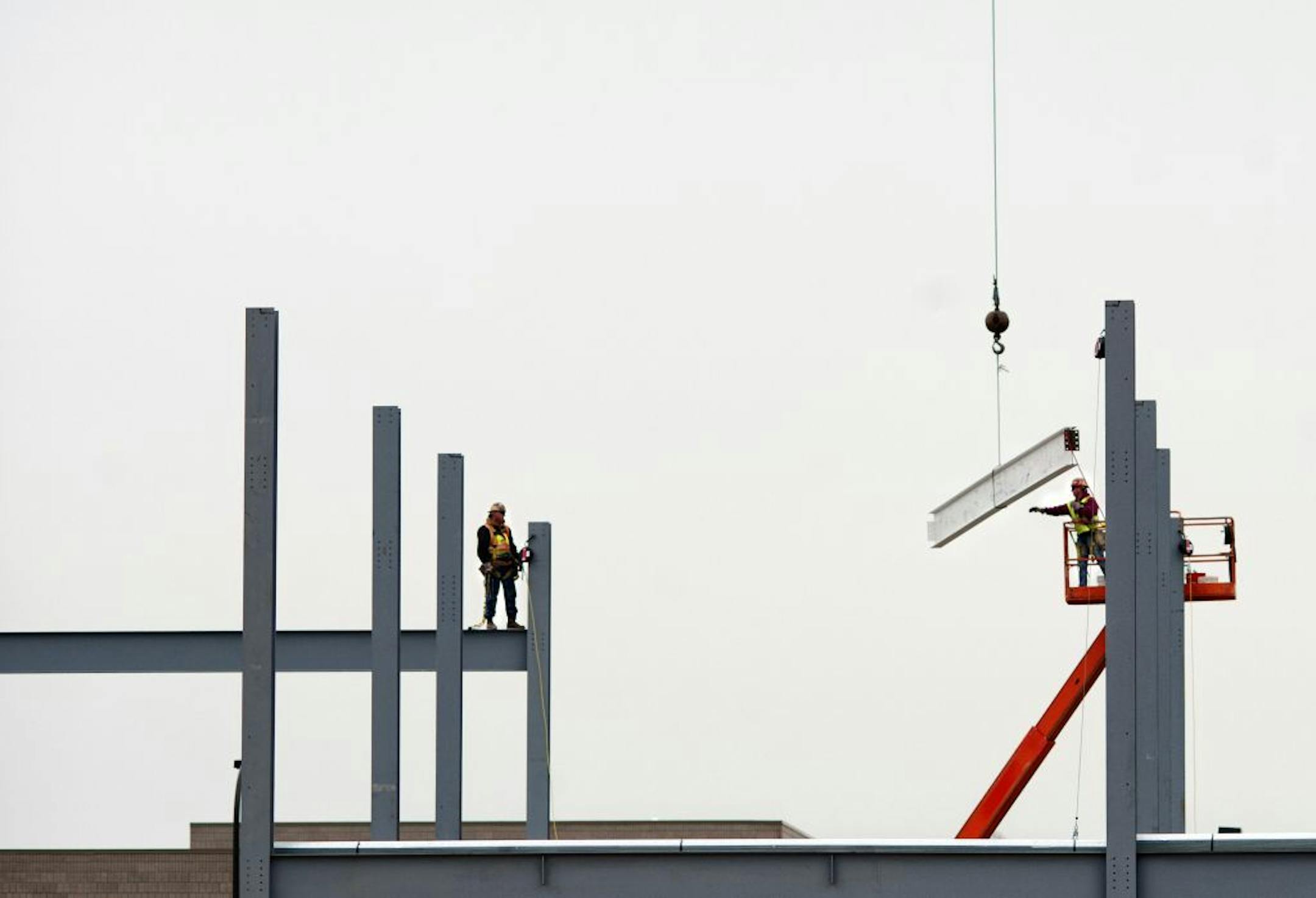 The signed beam is moved into position.