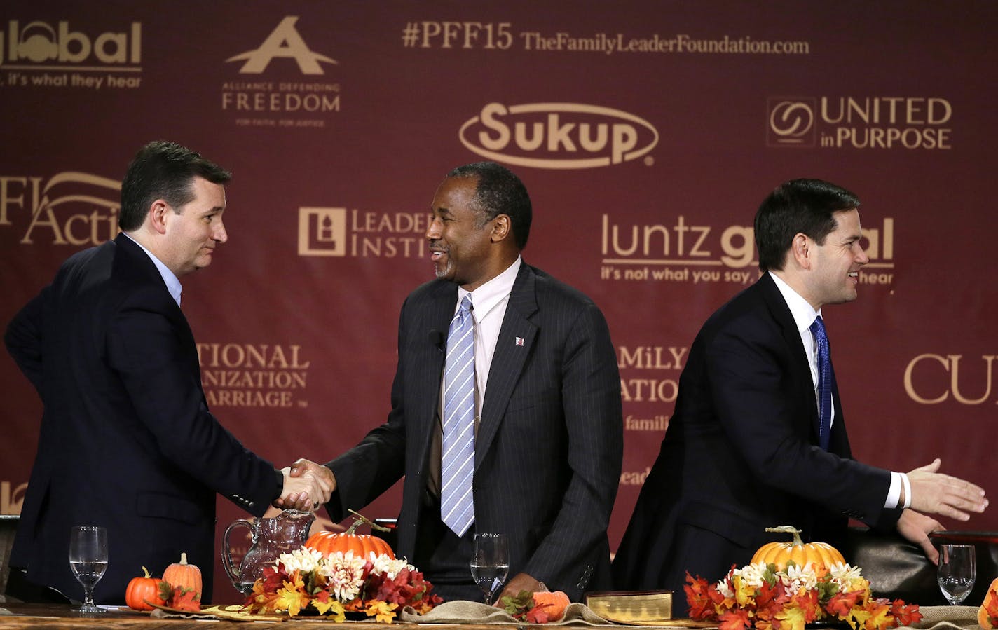 Republican presidential candidates, from left, Sen. Ted Cruz, R-Texas, Dr. Ben Carson and Sen. Marco Rubio, R-Fla., talk at the end of the Presidential Family Forum, Friday, Nov. 20, 2015, in Des Moines, Iowa. (AP Photo/Charlie Neibergall) ORG XMIT: MIN2016020912394522