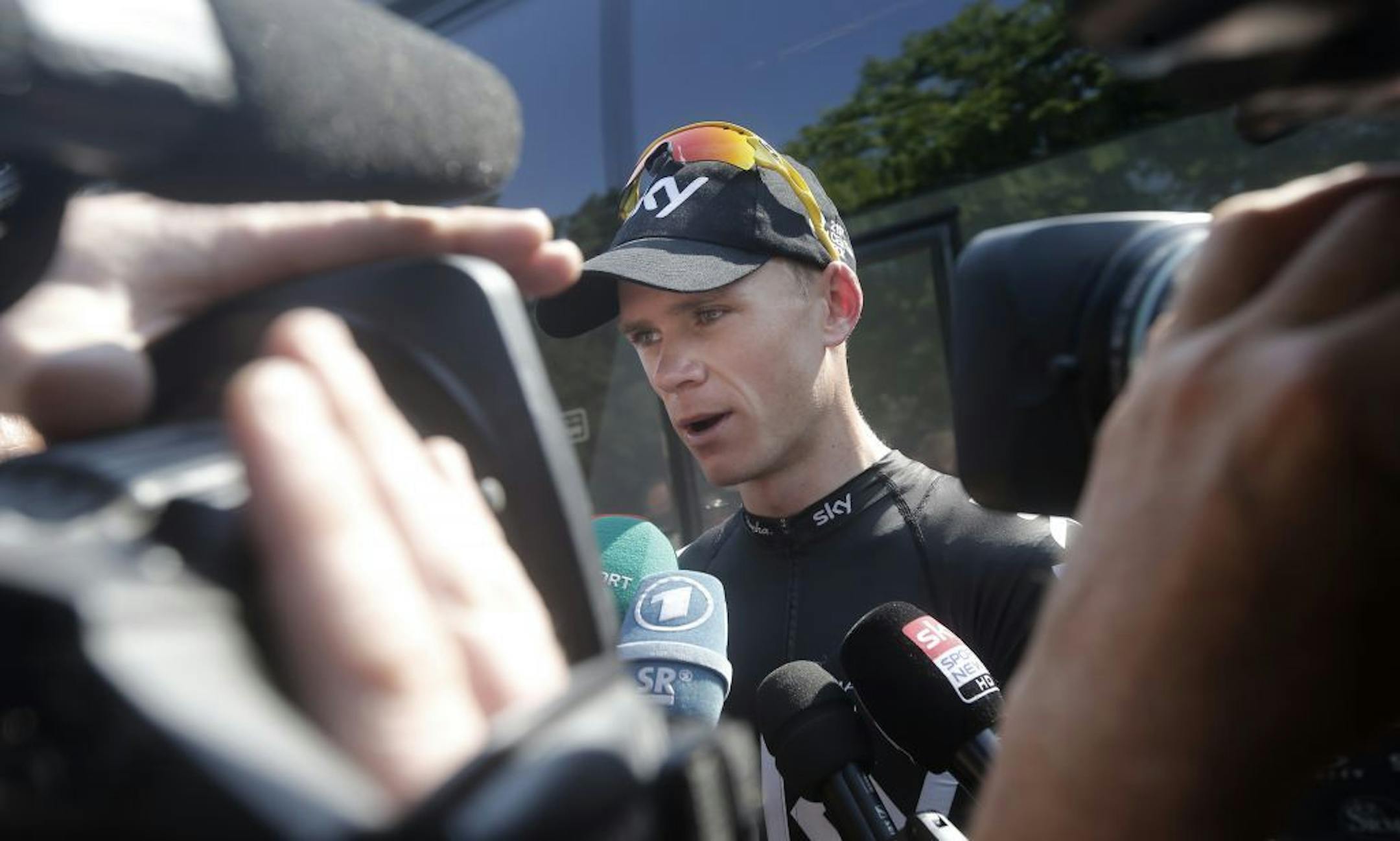 Overall leader Christopher Froome of Britain answers questions of reporters on the rest day of the Tour de France cycling race in Orange, southern France, Monday July 15, 2013.