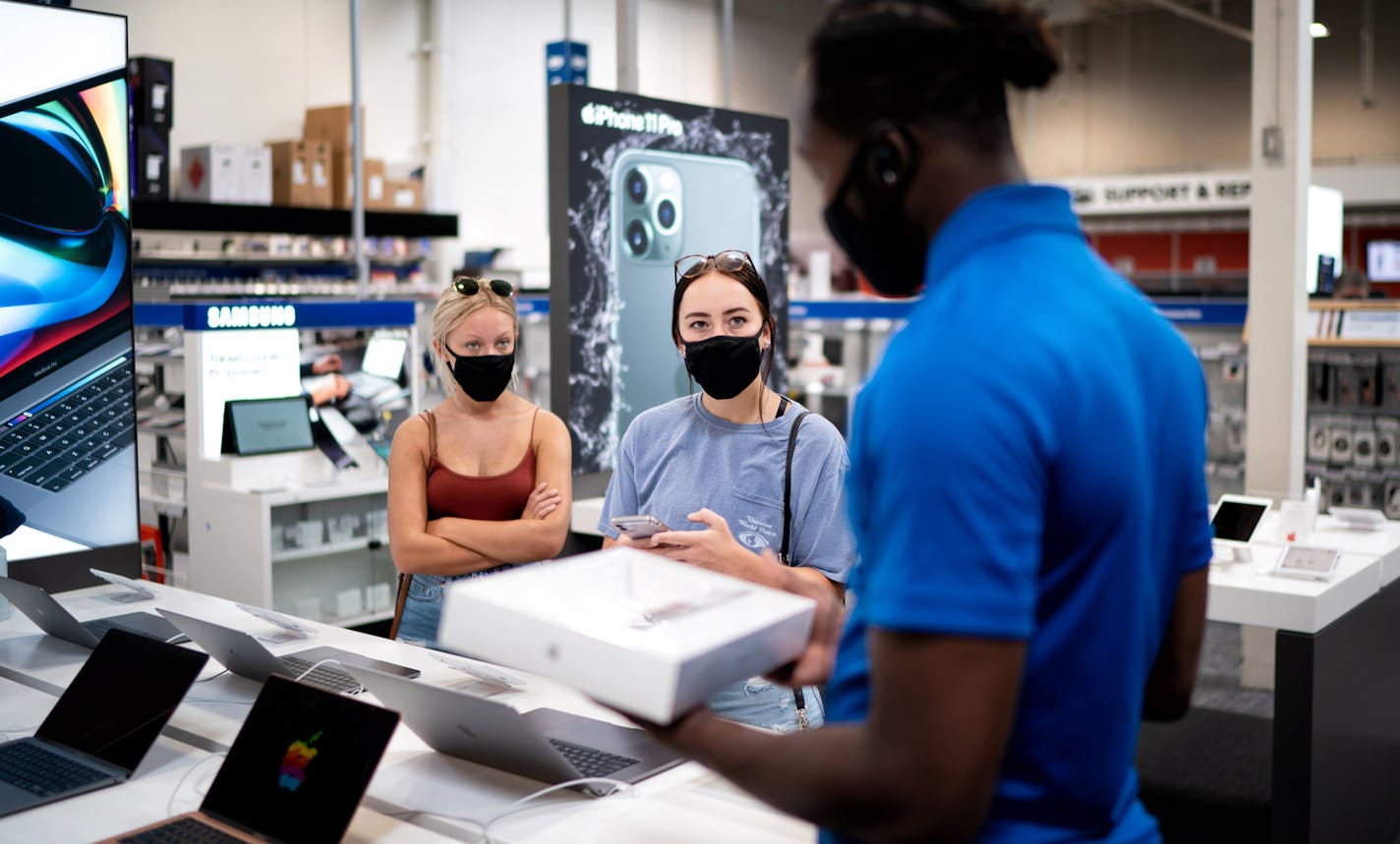 Brianna Reinarts, right, senior at University of St Thomas and Mackenzie Turner, senior at the University of Minnesota, shopped at Best Buy in Roseville. (GLEN STUBBE/Star Tribune)