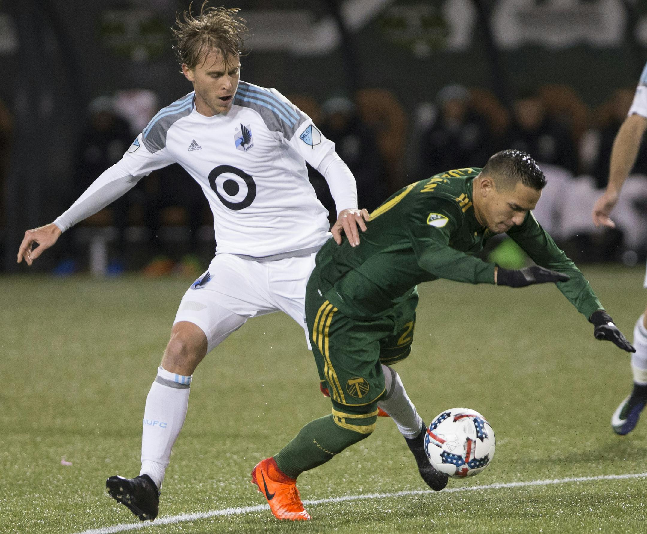 Minnesota United midfielder Rasmus Schuller (20) is cut off by Portland Timbers midfielder David Guzman (20) in the first half of an MLS soccer game in Portland, Ore., Mar. 3, 2017. (AP Photo/Randy L. Rasmussen) ORG XMIT: ORRR101