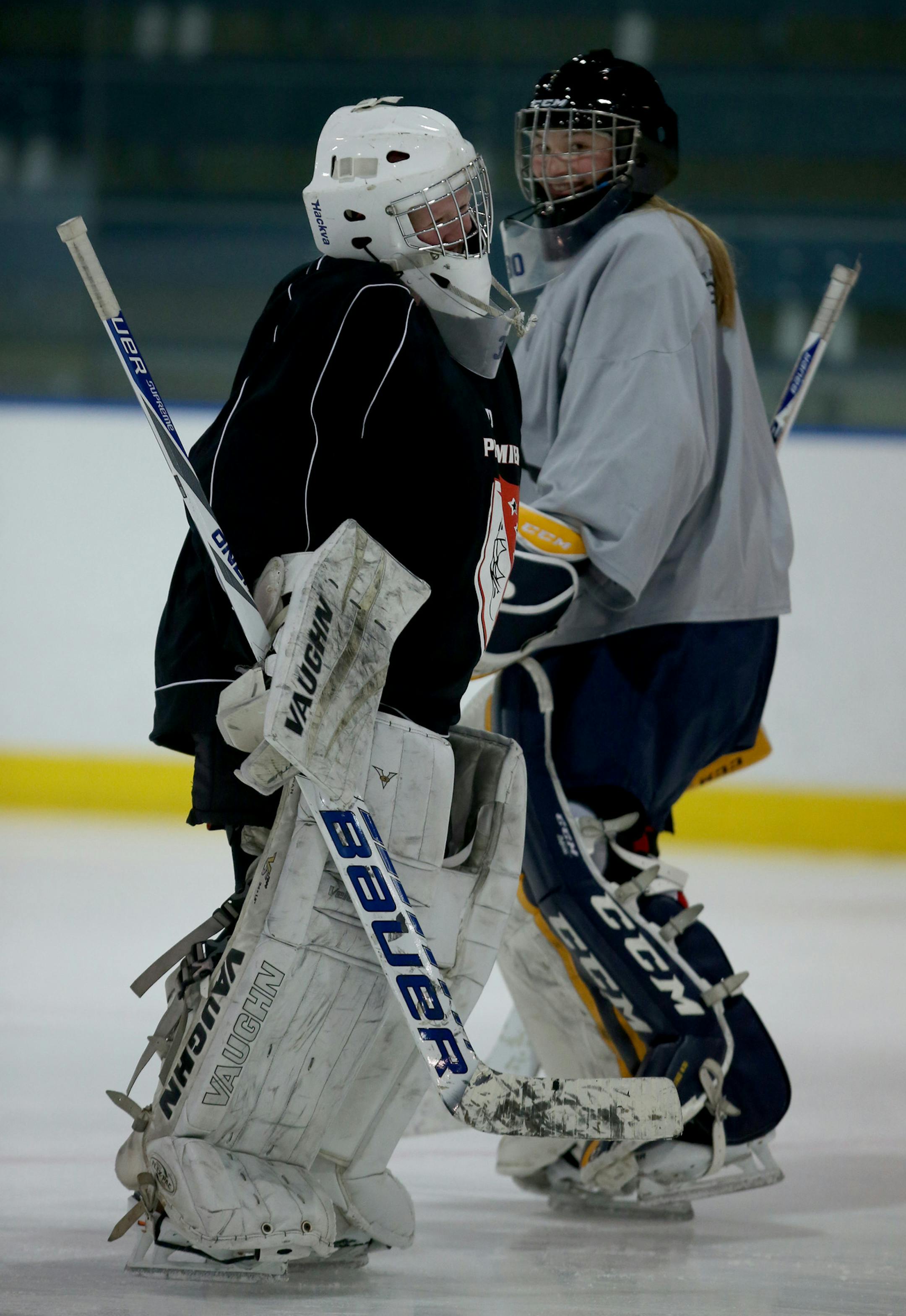 Goalies Jenna Brenneman, left, and Sydney Scobee share the Breck net. Both juniors have committed to D-I programs.