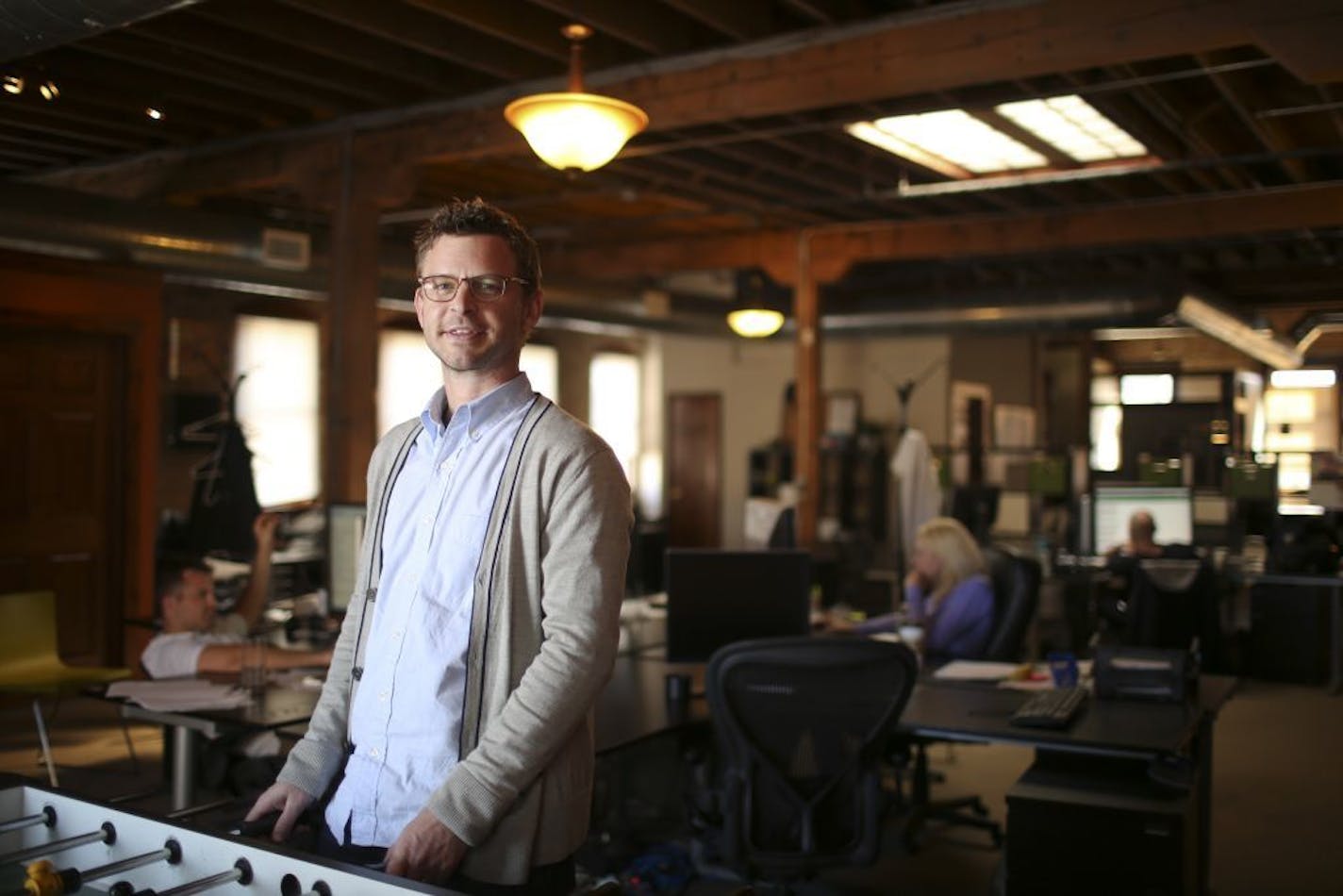 Chris Carlson, who knows his way around a foosball table, in the Fourcubed offices in Minneapolis Thursday afternoon, March 13, 2014.