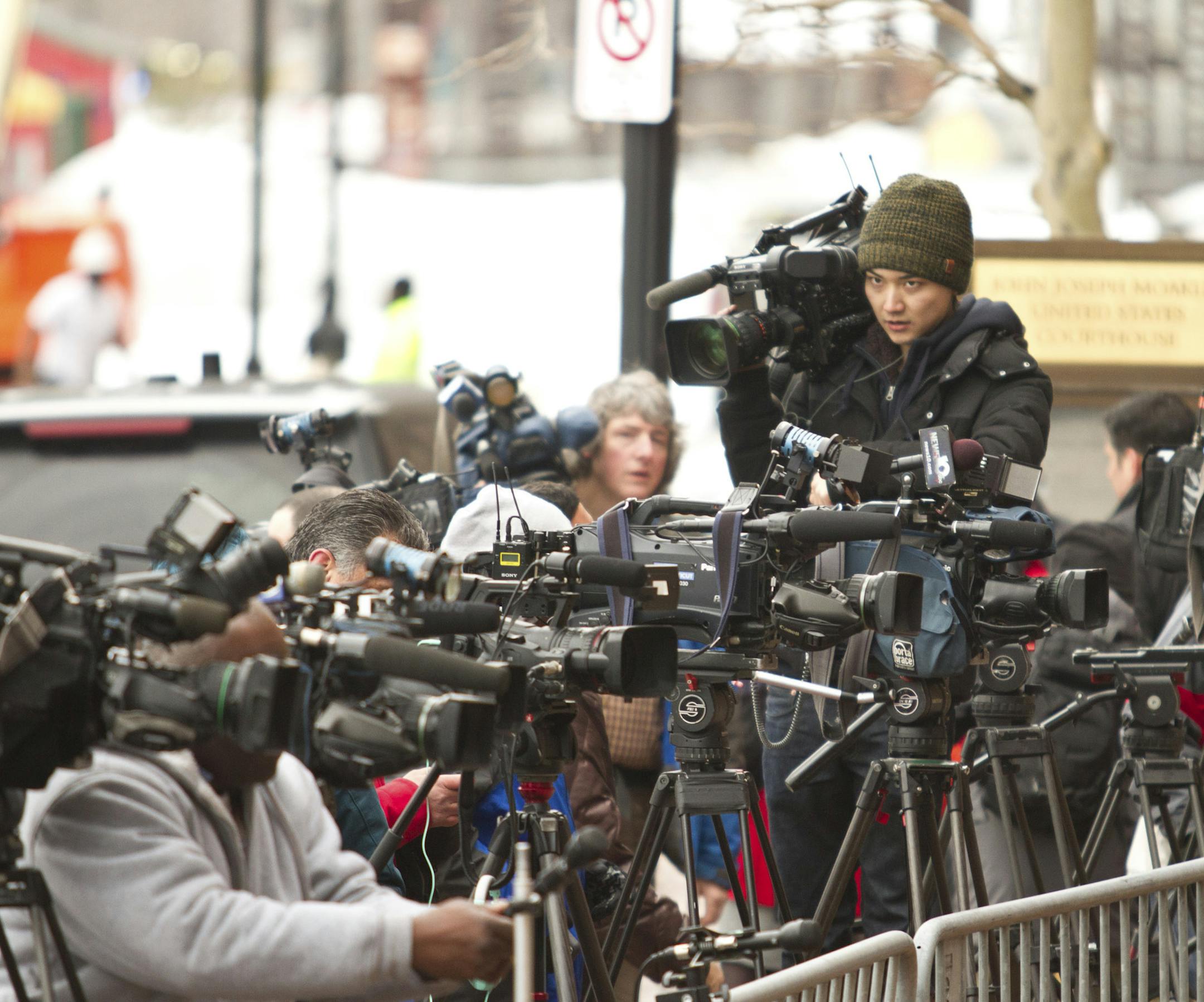 Reporters gathered outside the John Joseph Moakley Courthouse in Boston, the morning of March 4, 2015. Opening arguments in the trial of Dzhokhar Tsarnaev, charged in the 2013 Boston Marathon bombings that killed three and injured 260, began there Wednesday. (Erik Jacobs/The New York Times)