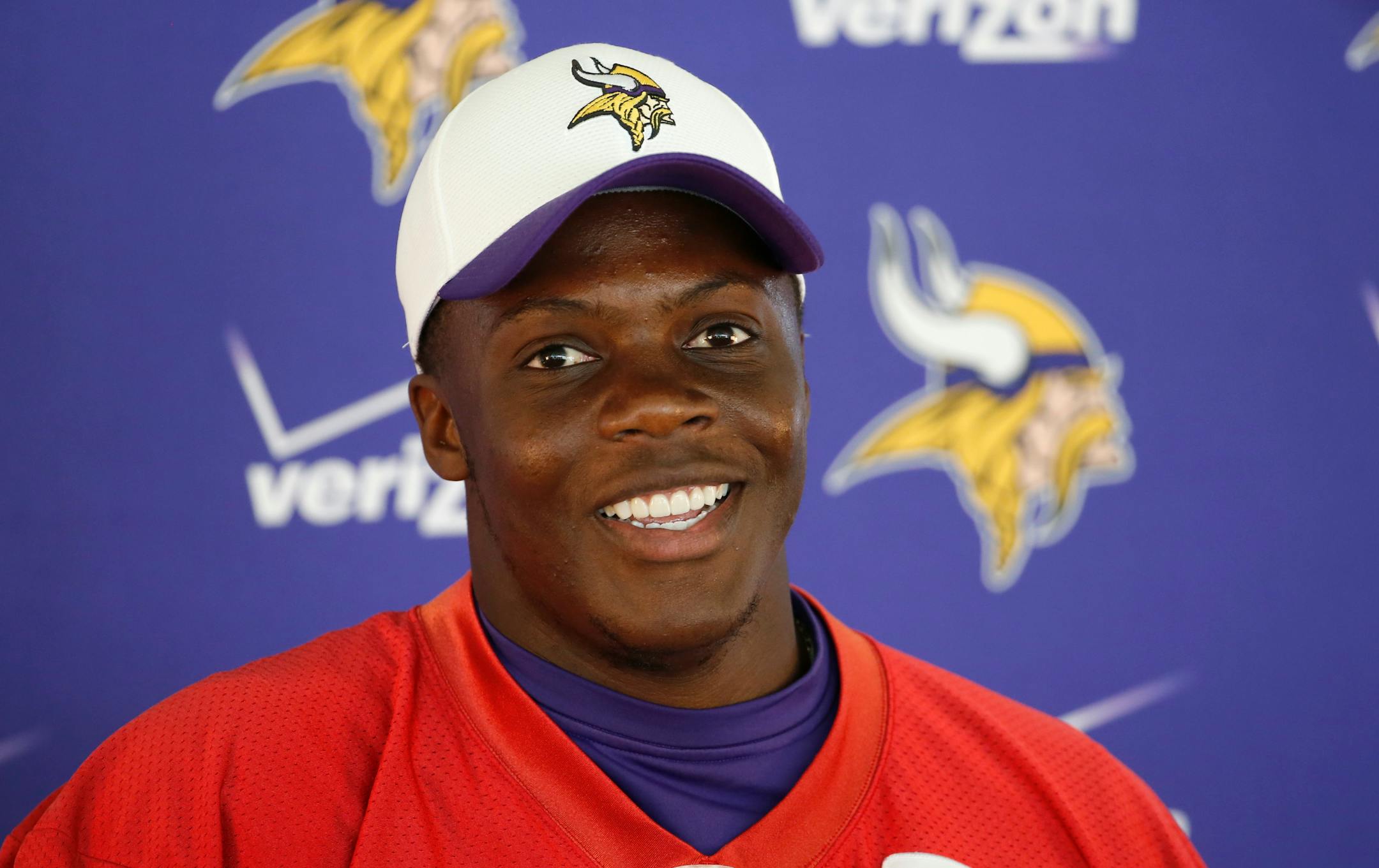 Minnesota Vikings quarterback Teddy Bridgewater smiles as he talks to reporters after the morning practice session at an NFL football training camp on the campus of Minnesota State University Wednesday, July 29, 2015, in Mankato, Minn. (AP Photo/Charles Rex Arbogast)