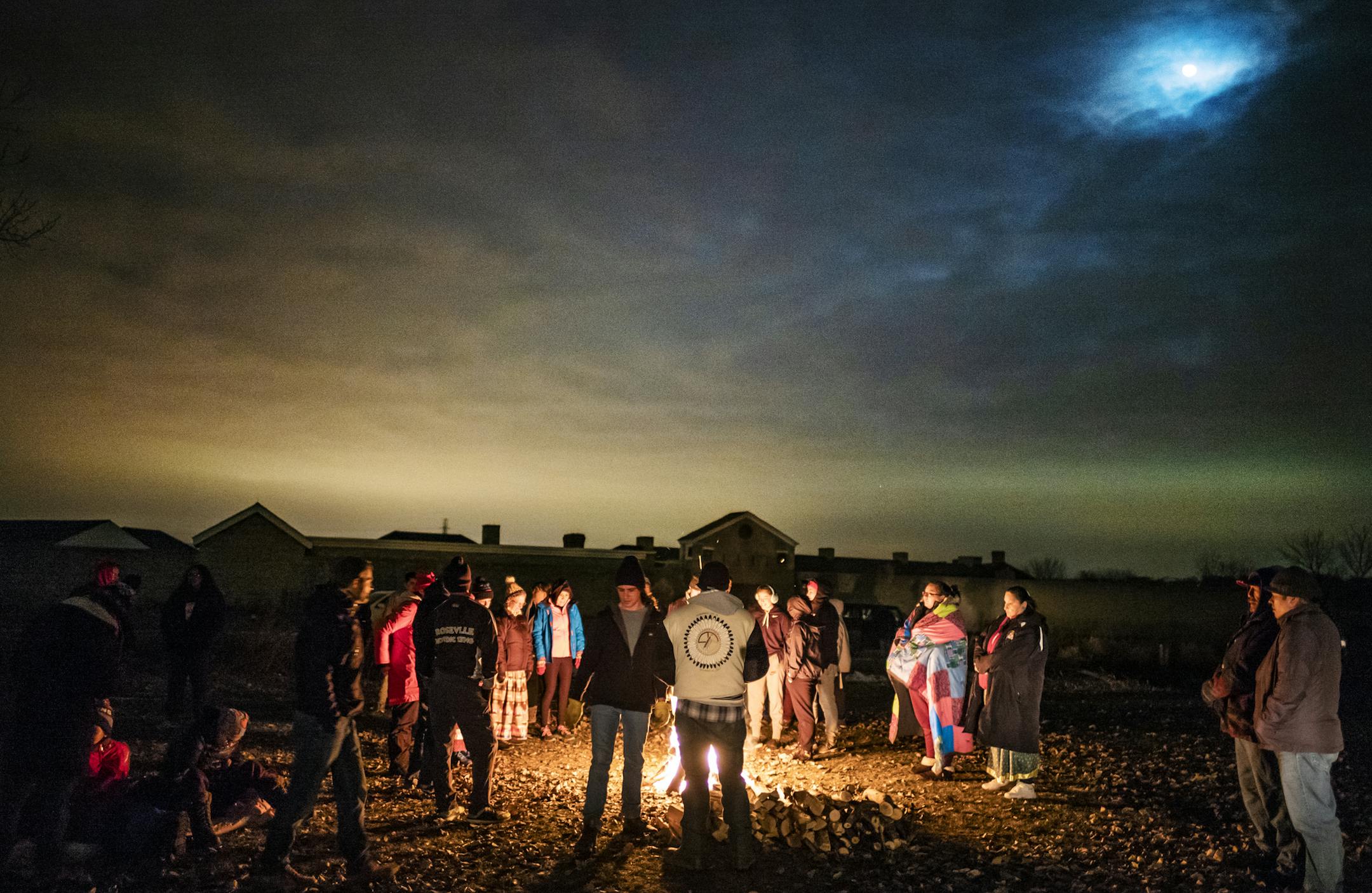 Participants gathered around a bonfire at Fort Snelling before the Dakota 38+2 Memorial Run, which marks the largest mass hanging in U.S. history.