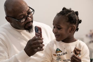 Makeysa Morgan talks to her son Mau’rese, 3, on the phone. Her parents are caring for Mau’rese while she serves a four-year prison sentence after 