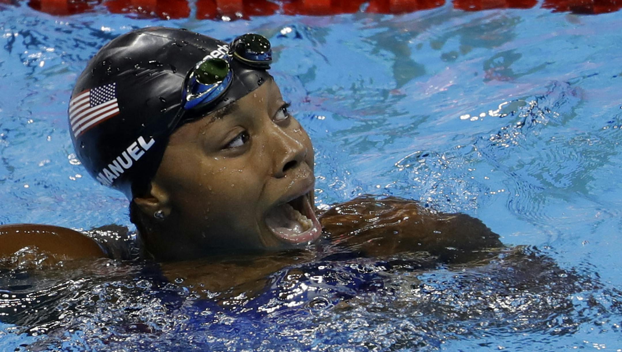 United States' Simone Manuel celebrates winning the gold medal and setting a new olympic record in the women's 100-meter freestyle during the swimming competitions at the 2016 Summer Olympics, Thursday, Aug. 11, 2016, in Rio de Janeiro, Brazil. (AP Photo/Natacha Pisarenko) ORG XMIT: OSWM617
