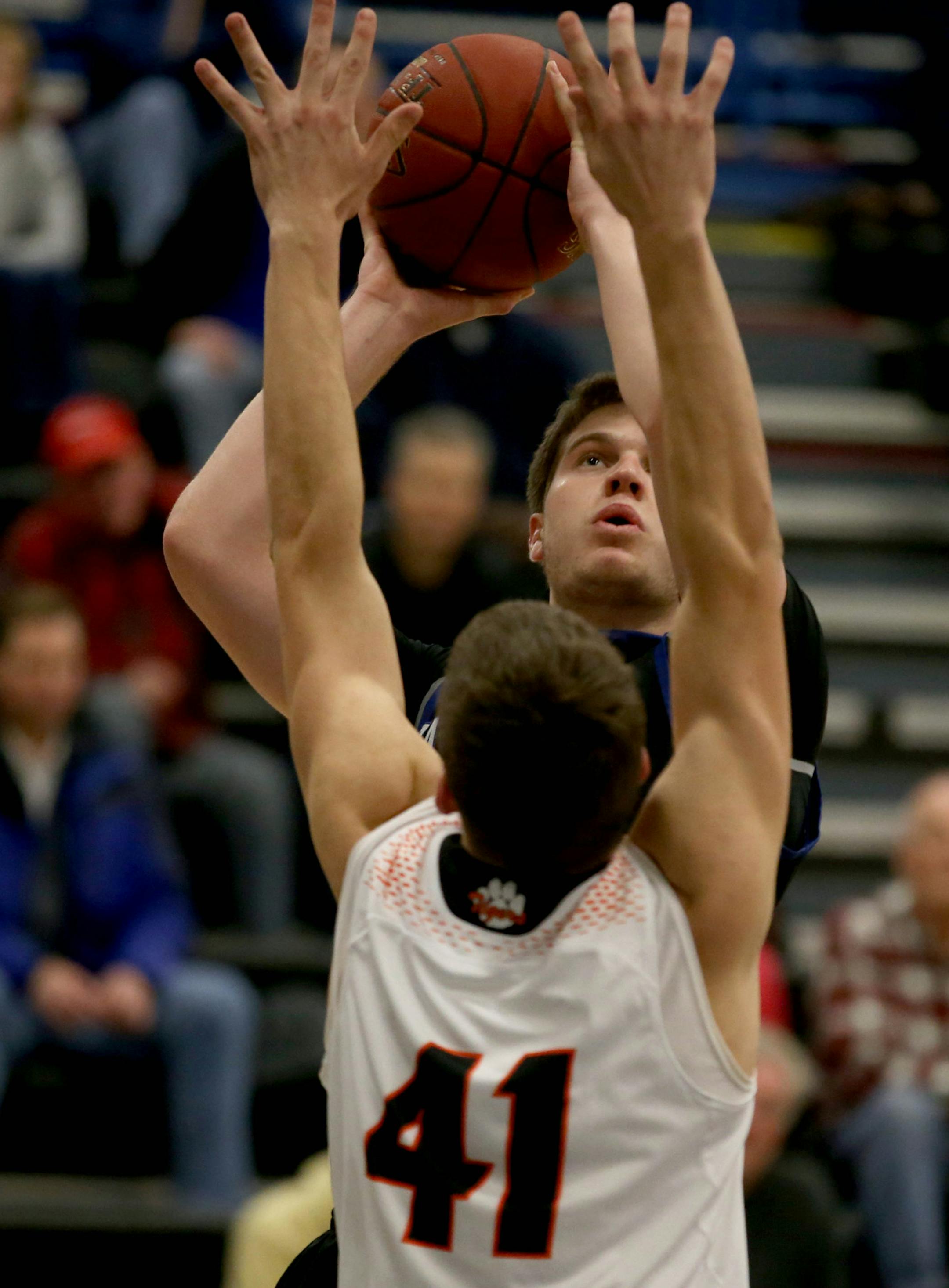 Eastview's Keegan Dickson pulled up for a lay up et with Farmington's Alex Hart defending. ] (KYNDELL HARKNESS/STAR TRIBUNE) kyndell.harkness@startribune.com Eastview vs Farmington in Apple Valley Min., Thursday, January 15, 2014.