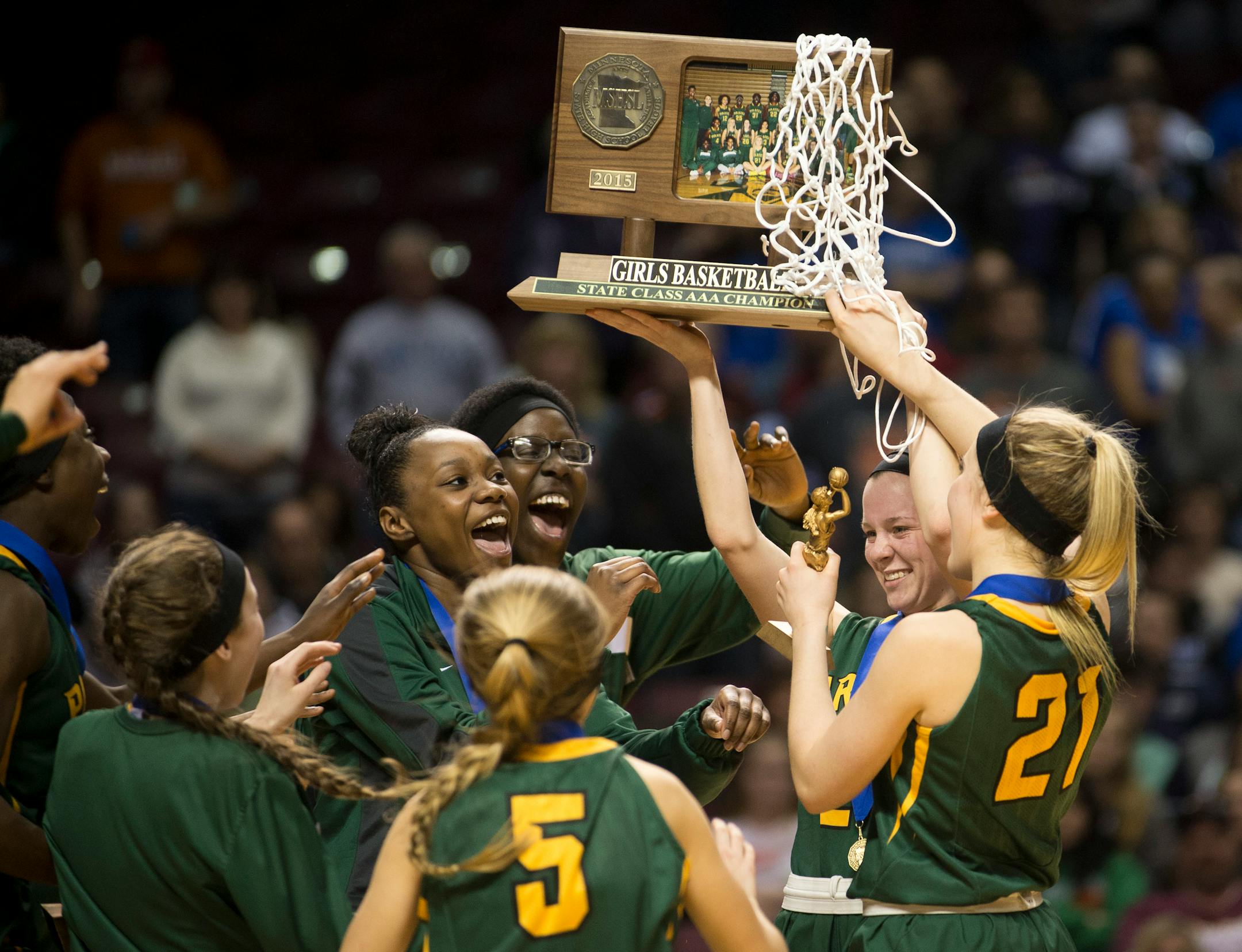 Park Center players celebrate with their championship trophy after defeating Marshall 52-45 in the Class 3A girls' basketball championship game on Saturday night. ] (Aaron Lavinsky | StarTribune) Marshall plays Park Center in the Class 3A girls' basketball championship game on Saturday, March 21, 2015 at Williams Arena. Park Center beat Marshall 52-45.
