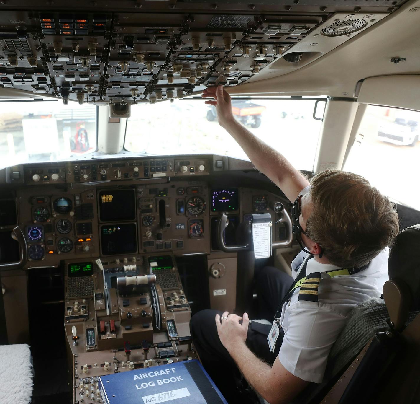 Delta's Clint Hill conducted a preflight check at Orlando International Airport. Delta pilots agreed to a pay cut.