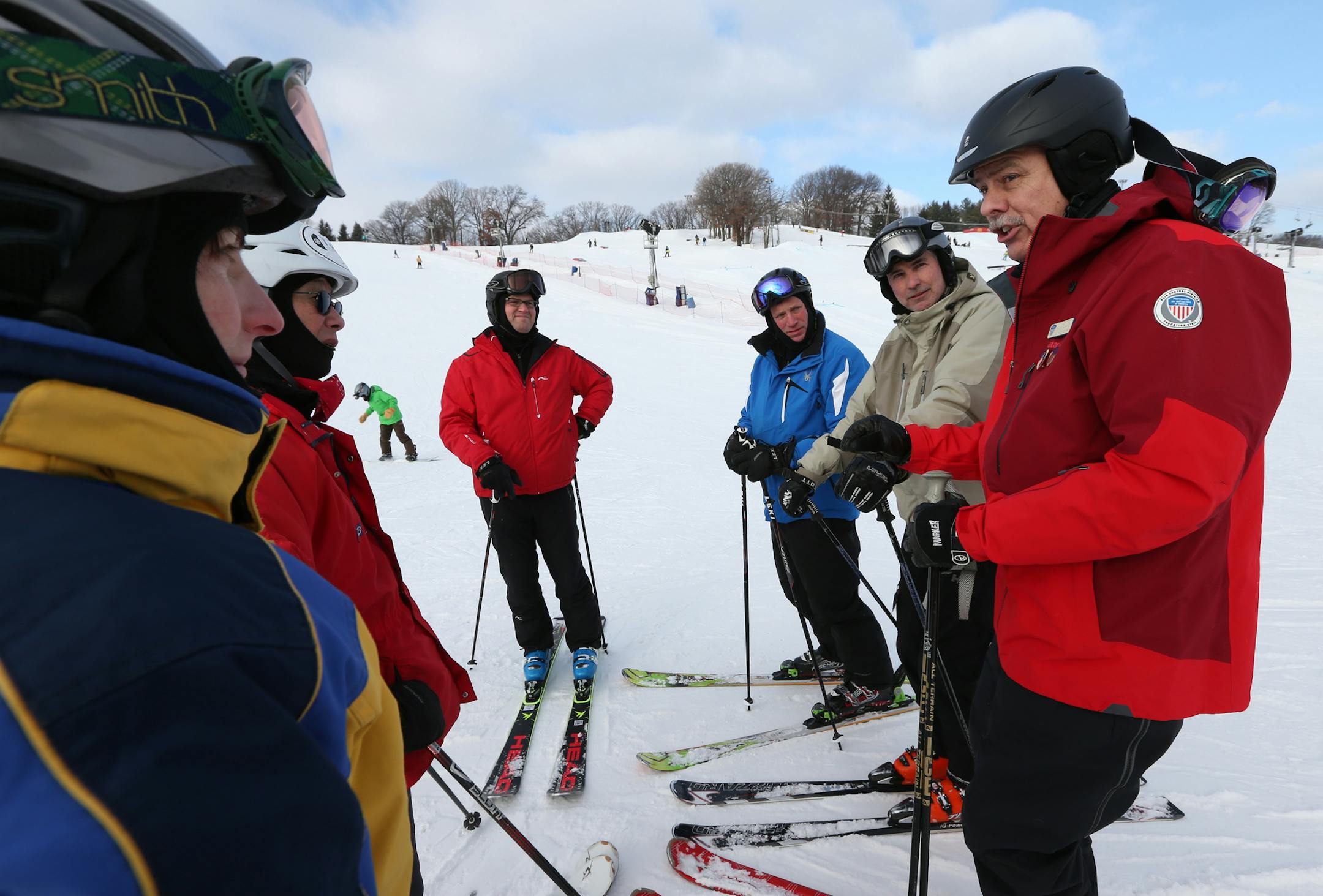 (right) Ski Instructor David Henderson taught adaptive ski techniques to Courage Center volunteers during a morning session at Hyland Hills on 1/4/14. Feature on Courage Kenny Ski and Snowboard Program, an adaptive ski and snowboard program that has been coordinated by the Courage Center for more than 30 years. It teaches children and adults with physical disabilities and vision impairments how to downhill ski and snowboard at Hyland Hills, Welch Village and Trollhaugen, It is an 8 week program.