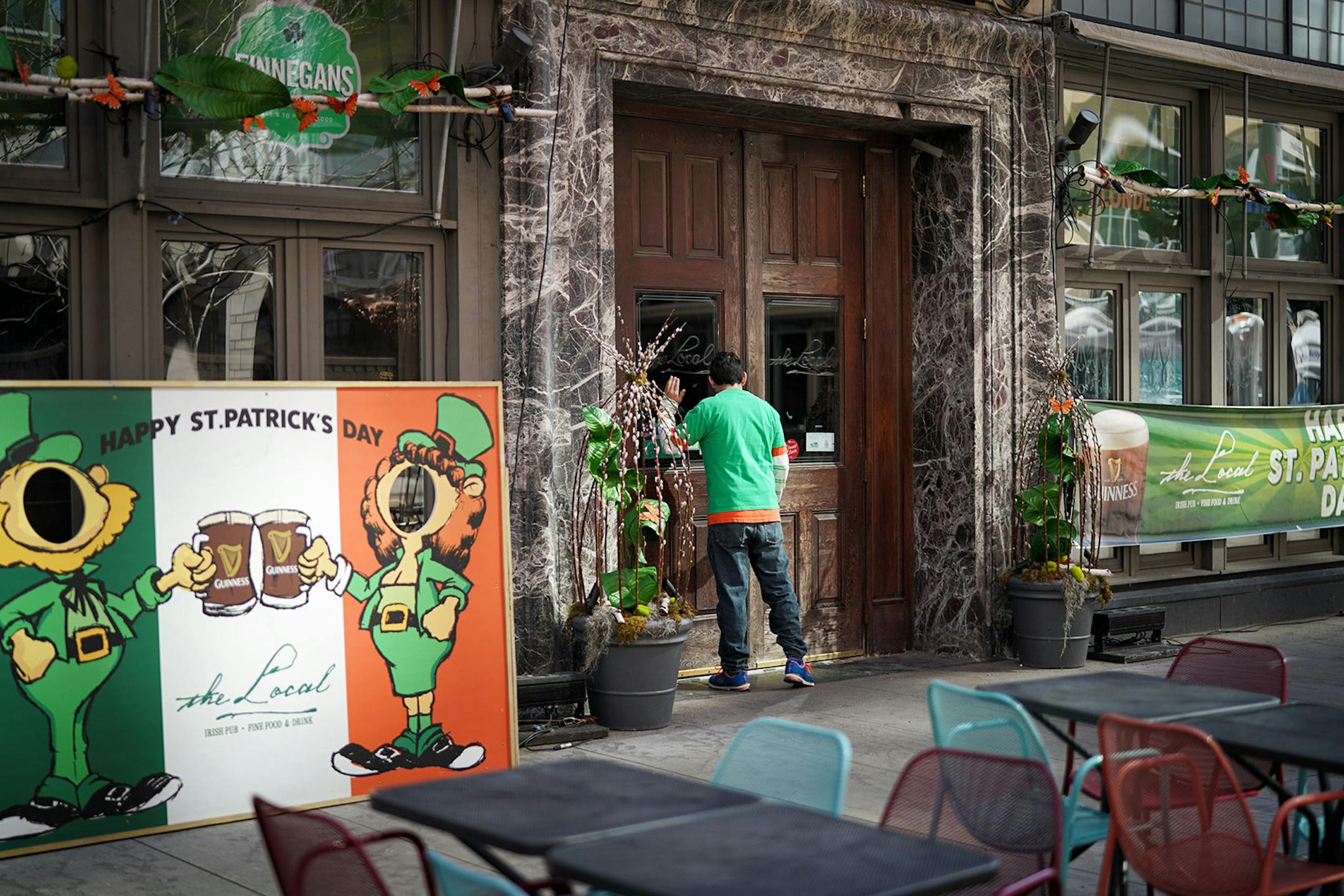 Nicky Garcia peered through the front door window of The Local, an Irish pub on Nicollet Mall which was decorated for St. Patricks Day but closed to customers.