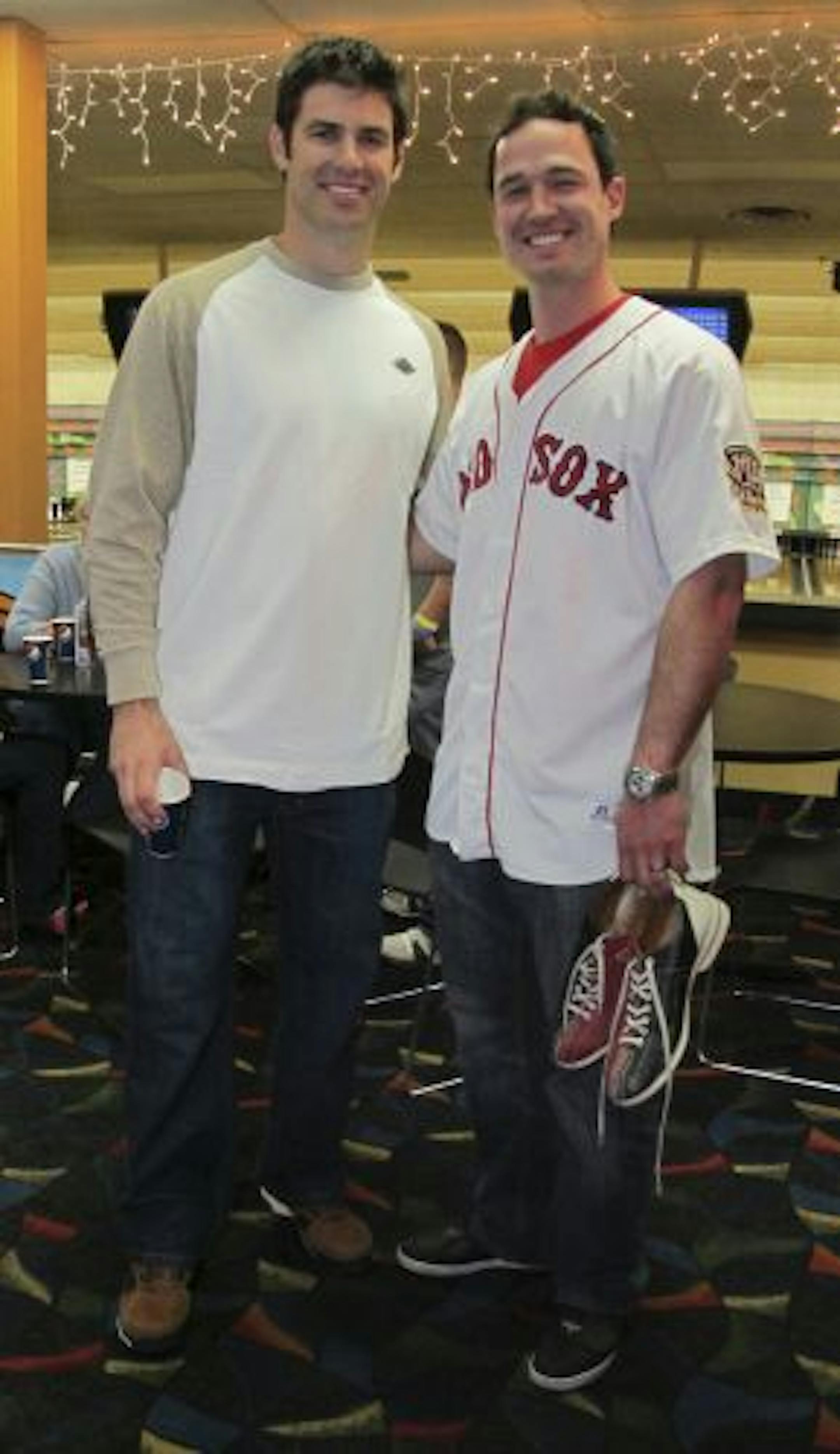 Minnesota Twins catcher Joe Mauer and Jack Hannahan of the Boston Red Sox